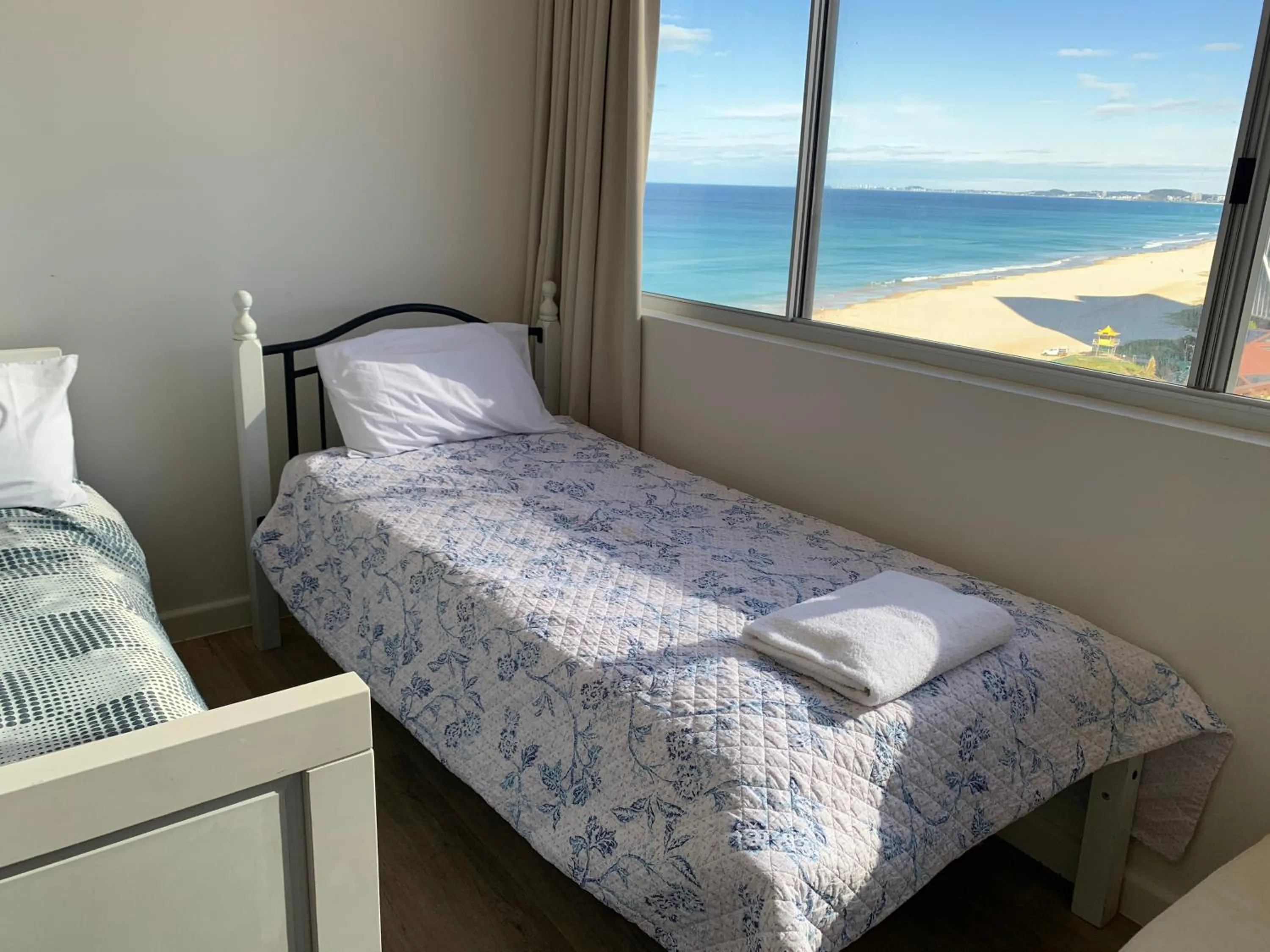 Bed in The Penthouses Apartments