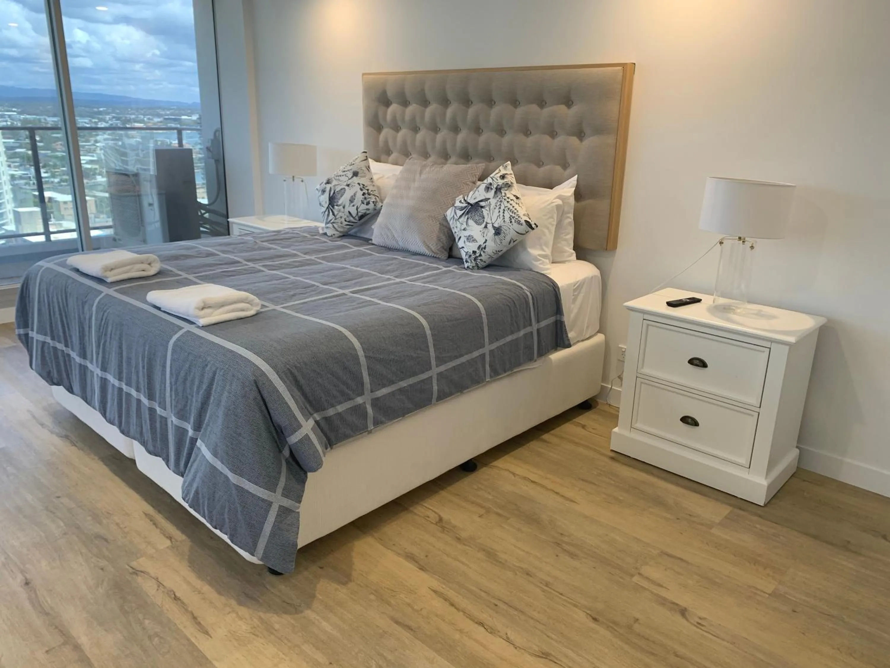 Bed in The Penthouses Apartments