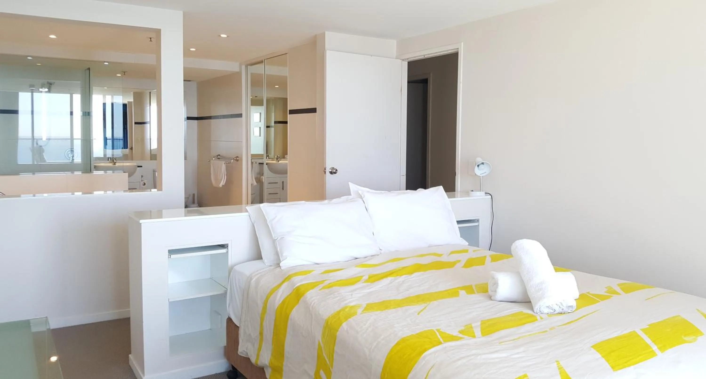 Bed in The Penthouses Apartments