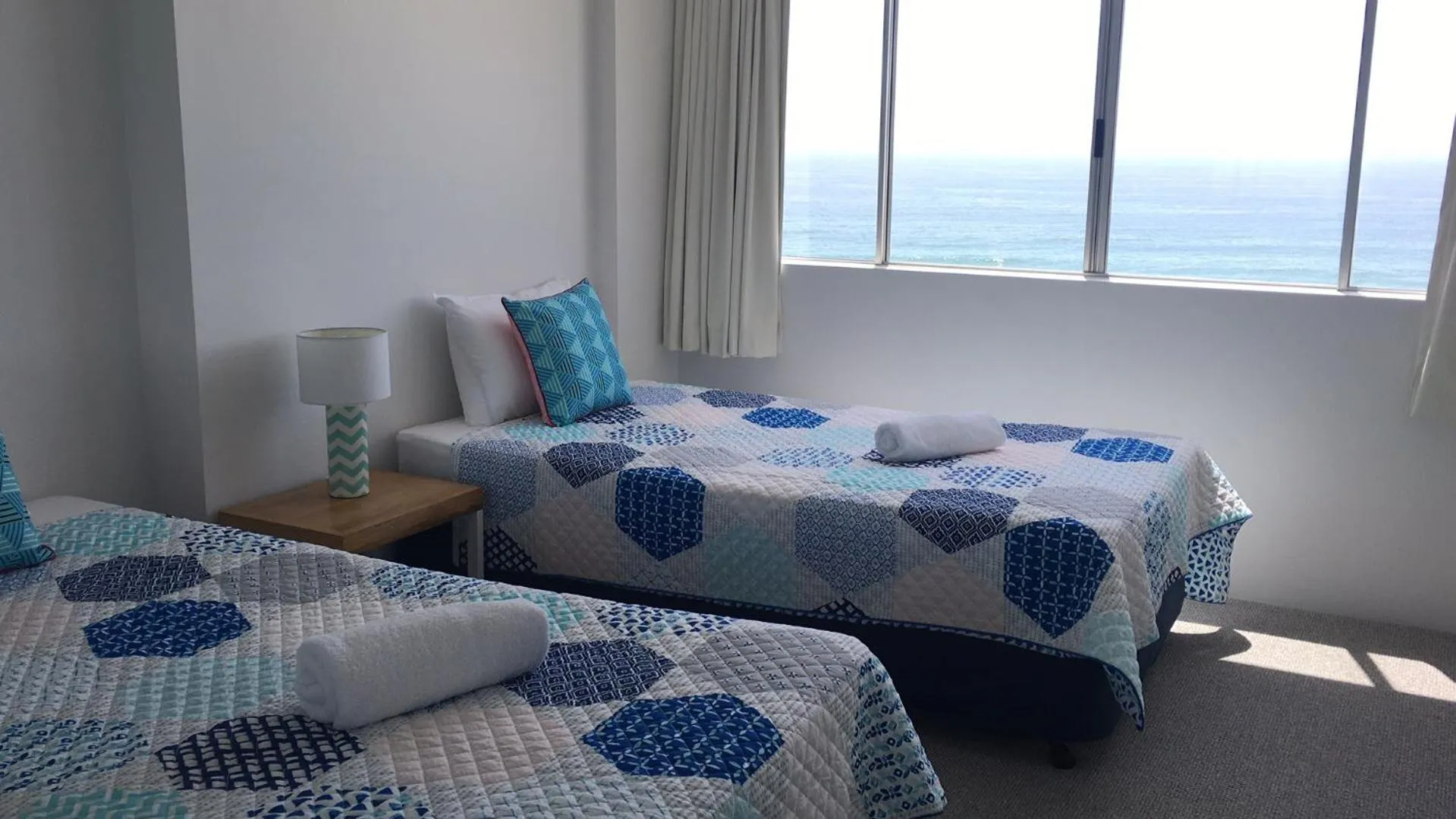 Bed in The Penthouses Apartments