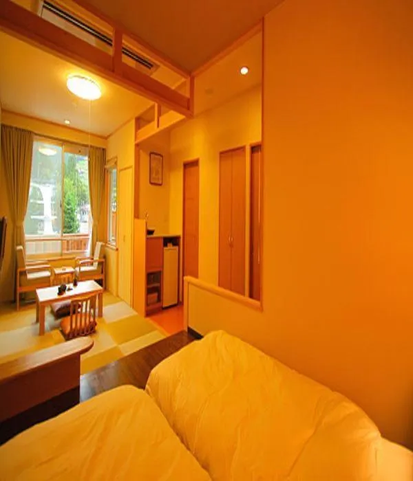 Bed in Nozawa Grand Hotel