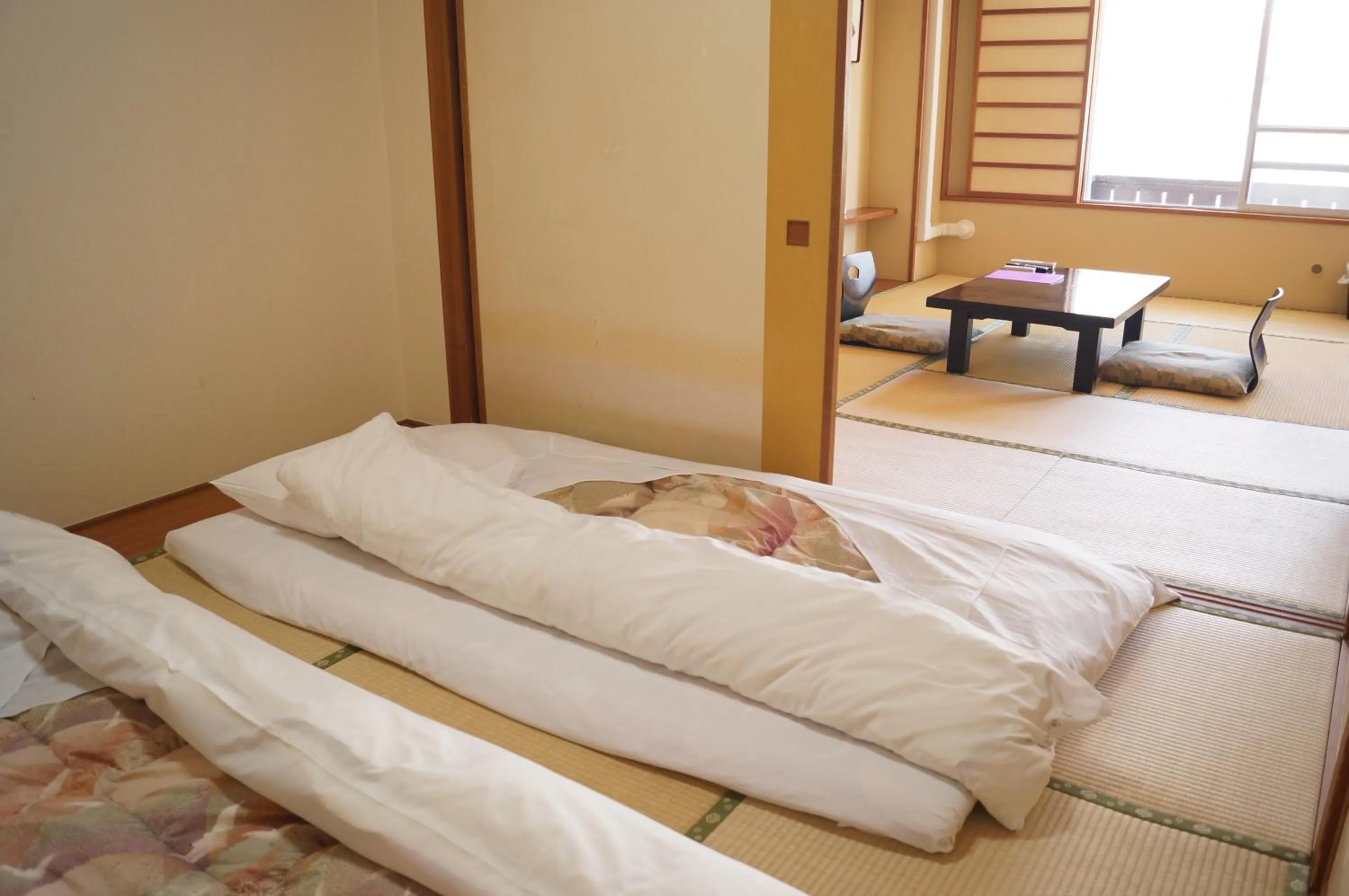 Bed in Nozawa Grand Hotel