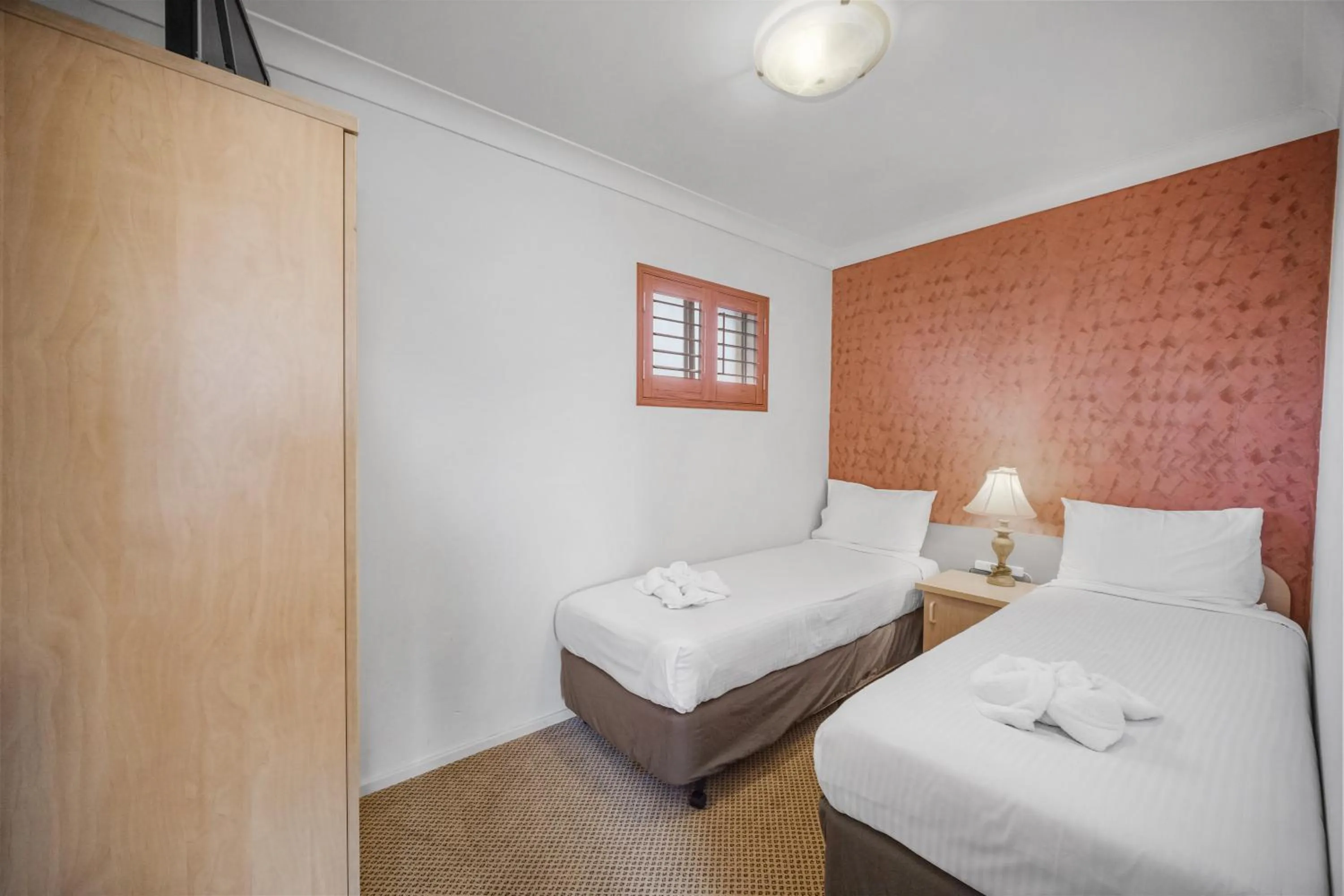 Bed in Country Plaza Motel Taree