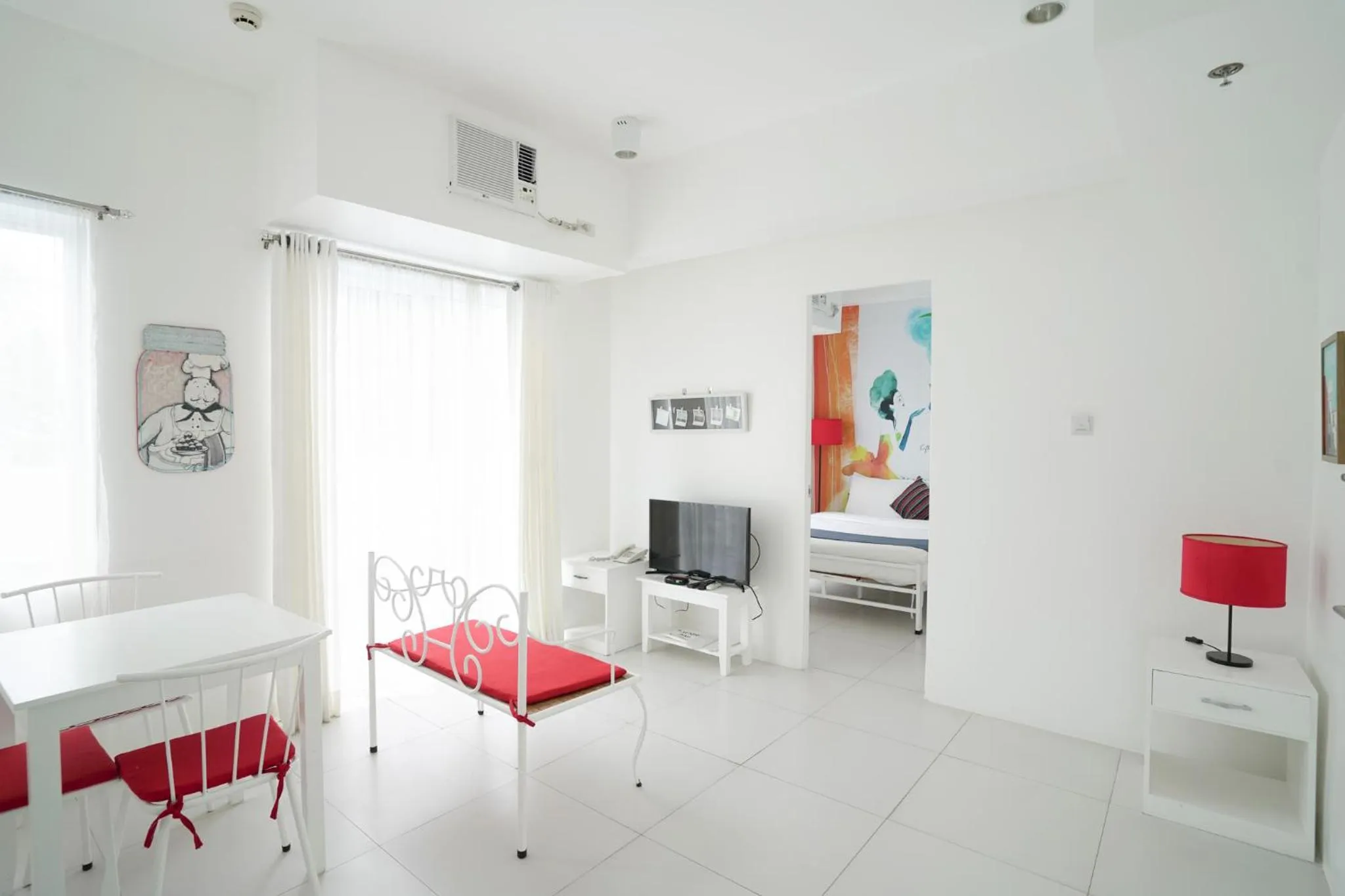 Living room, Bed in La Bella Boutique Hotel