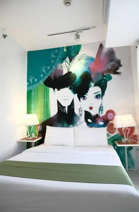 Bed in La Bella Boutique Hotel