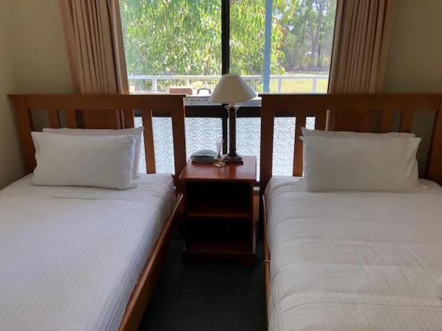 Bed in Twin Trees Country Cottages