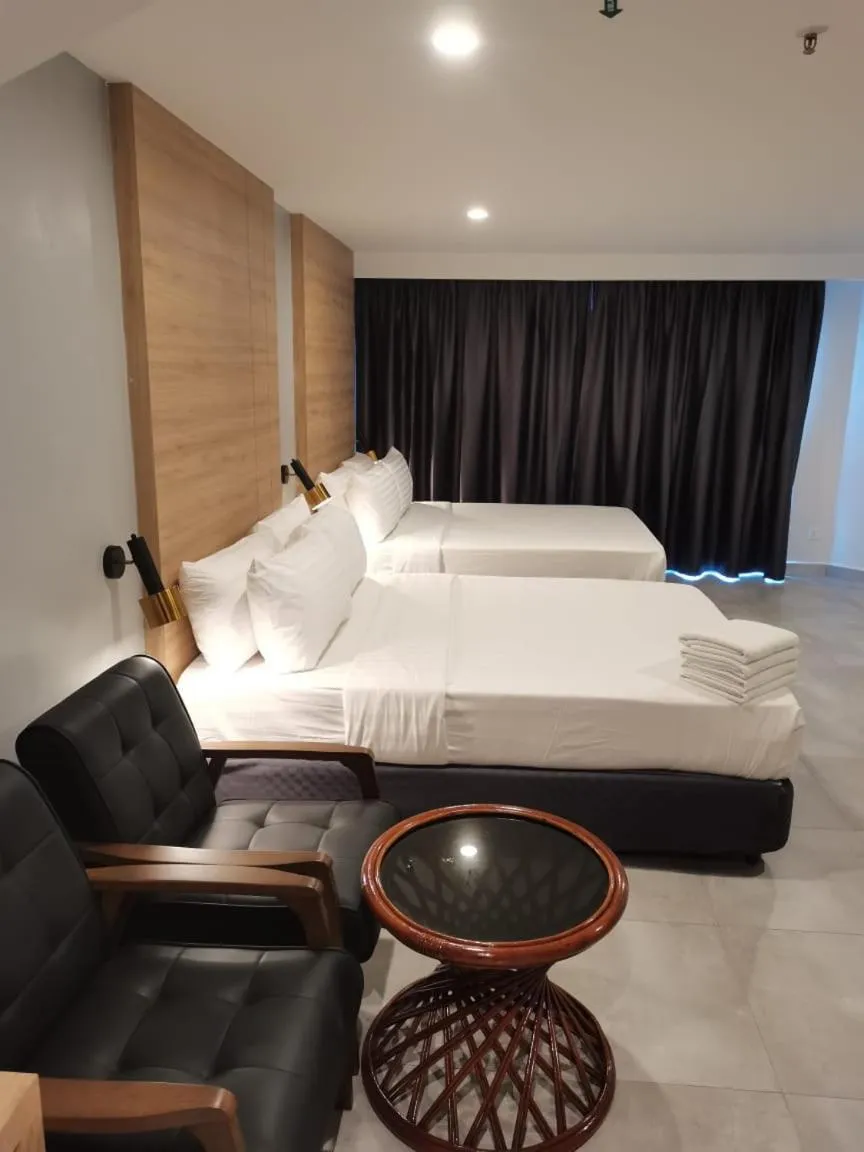 Seating area, Bed in Coral Bay Resort