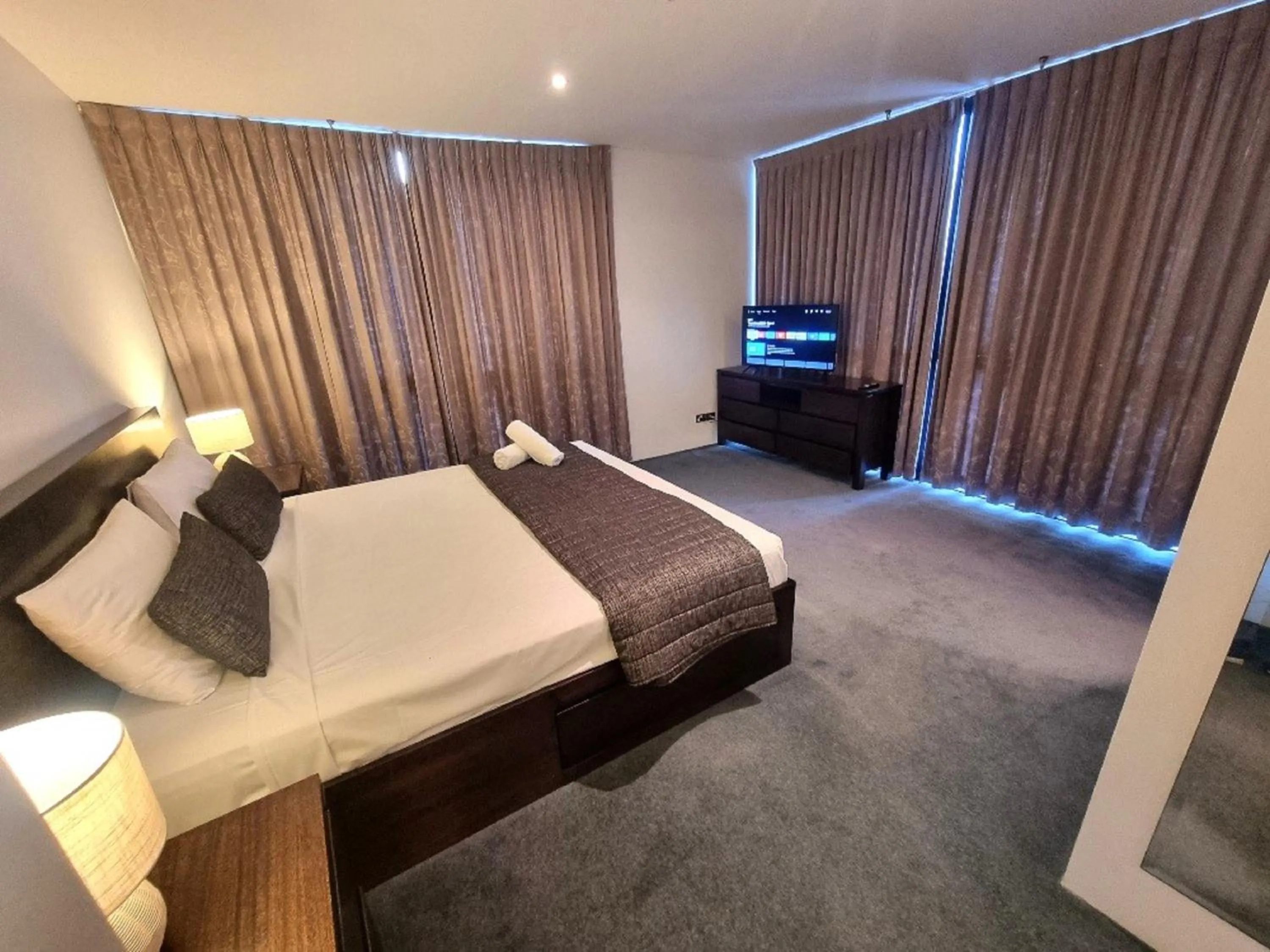 Bed in Aria Apartments