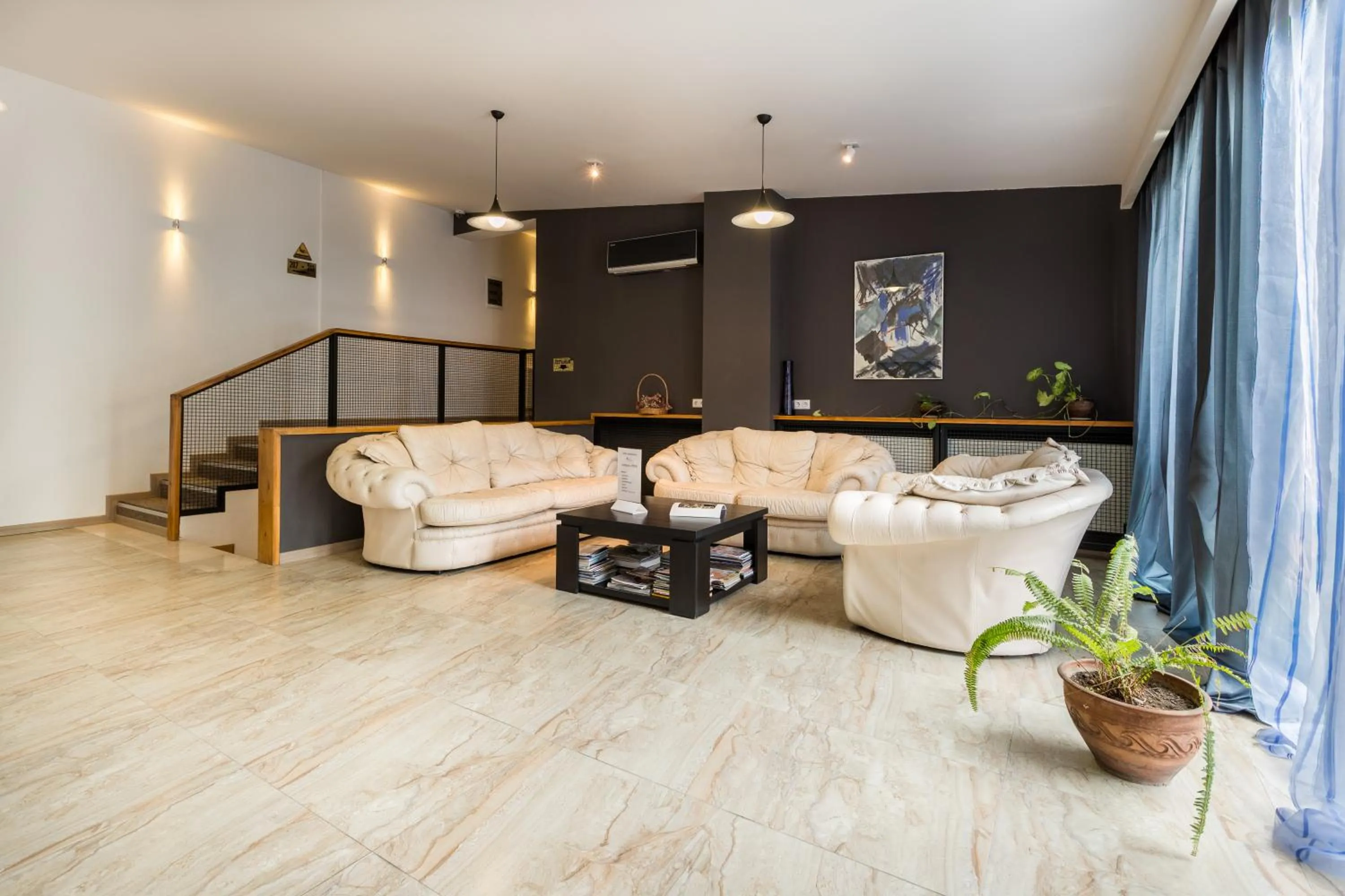 Communal lounge/ TV room in Alliance Hotel