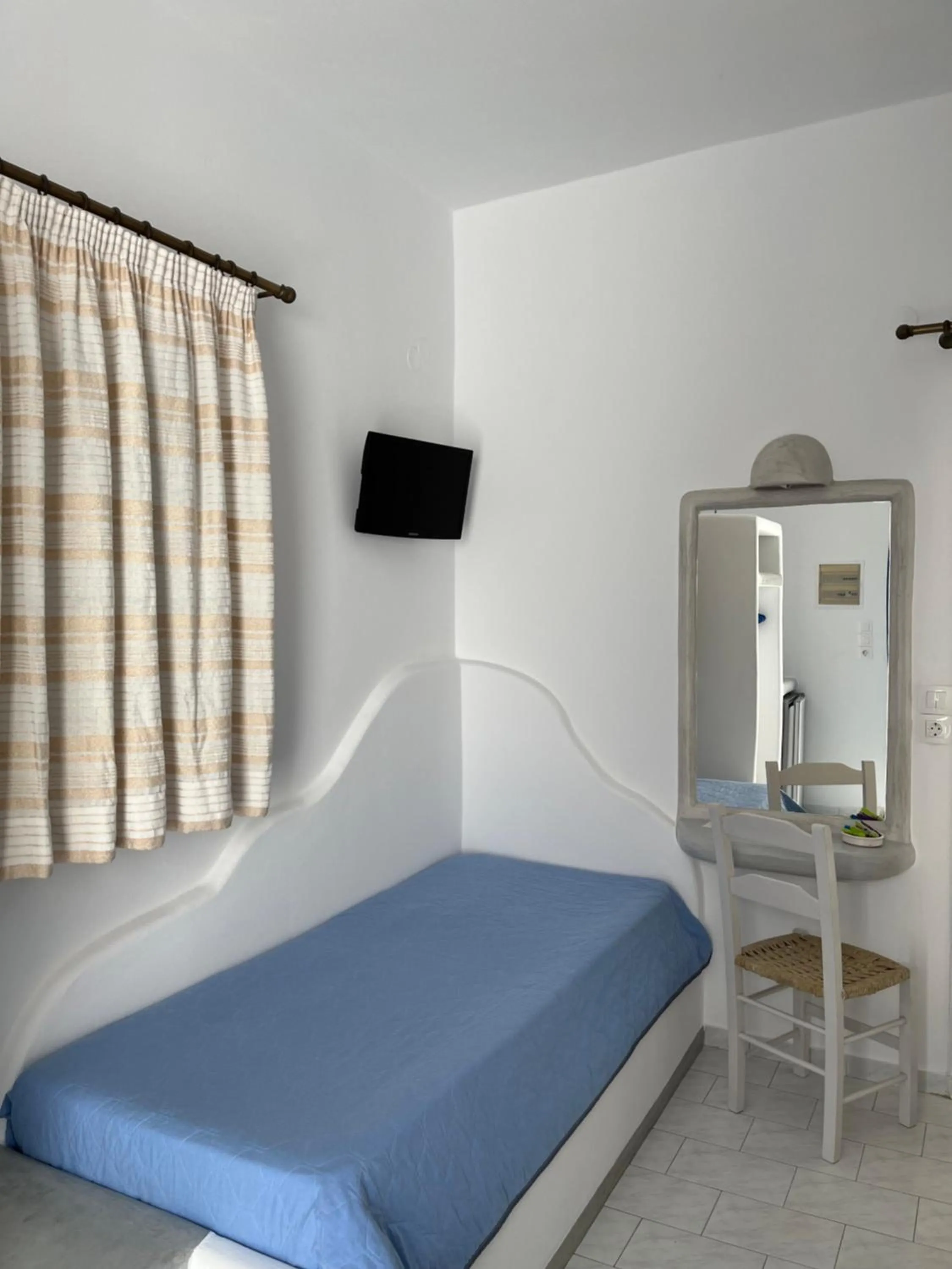 Photo of the whole room, Bed in Captain Stavros Milos