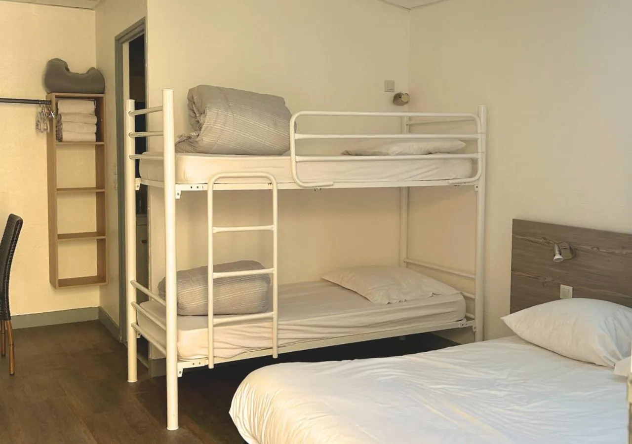 Photo of the whole room, Bed in Hôtel Le Carnon