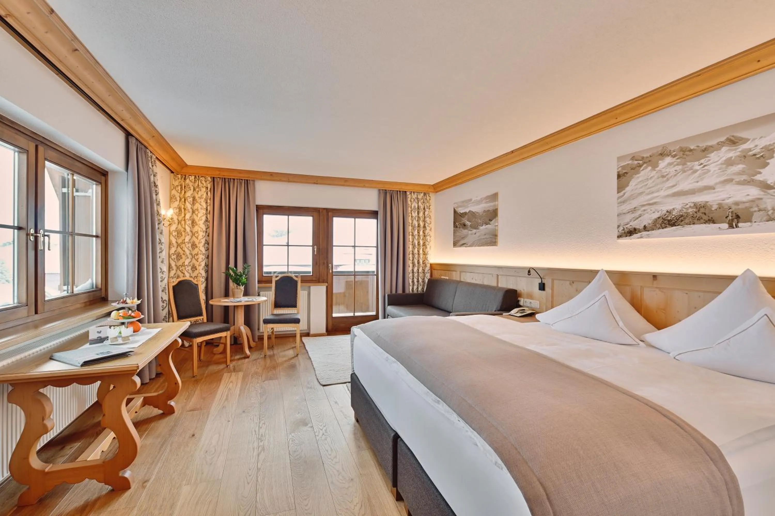 Seating area, Bed in Hotel Enzian