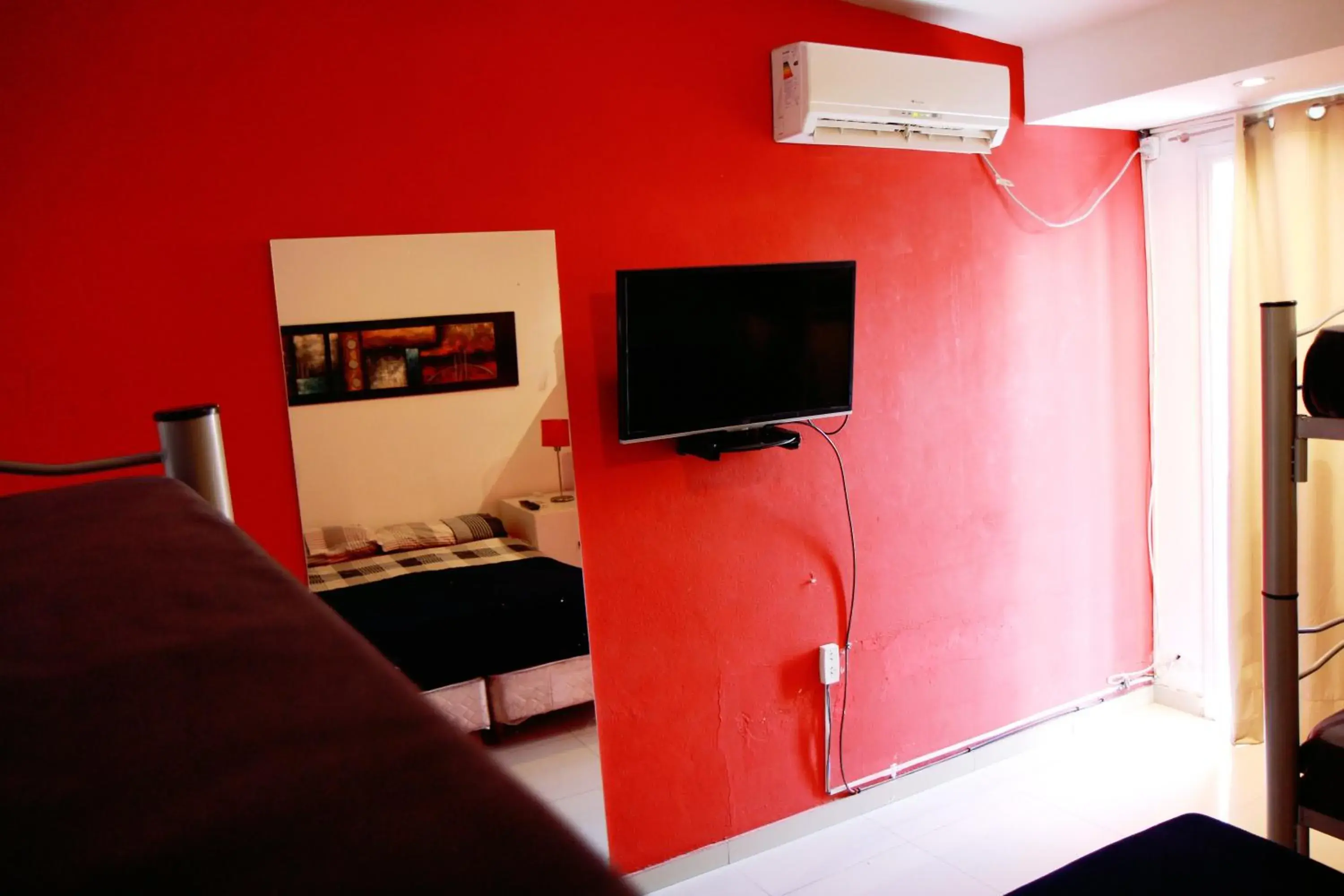 TV and multimedia, TV/Entertainment Center in Link Cordoba Hostel