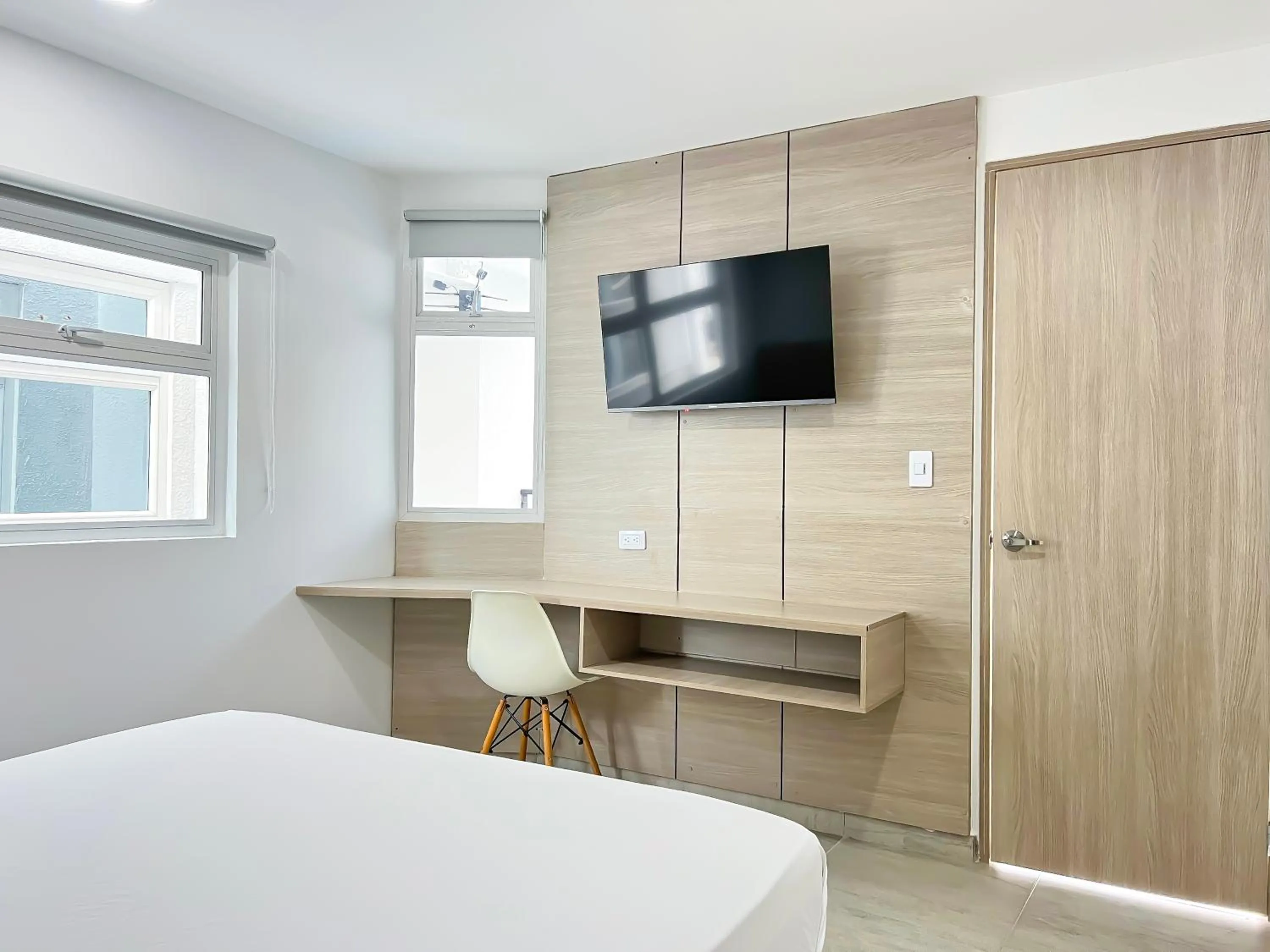 TV and multimedia, Bed in Stanza Hotel Monteria