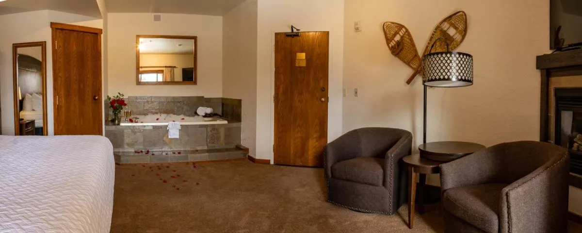 Seating area, Bed in A Bear and Bison Country Inn
