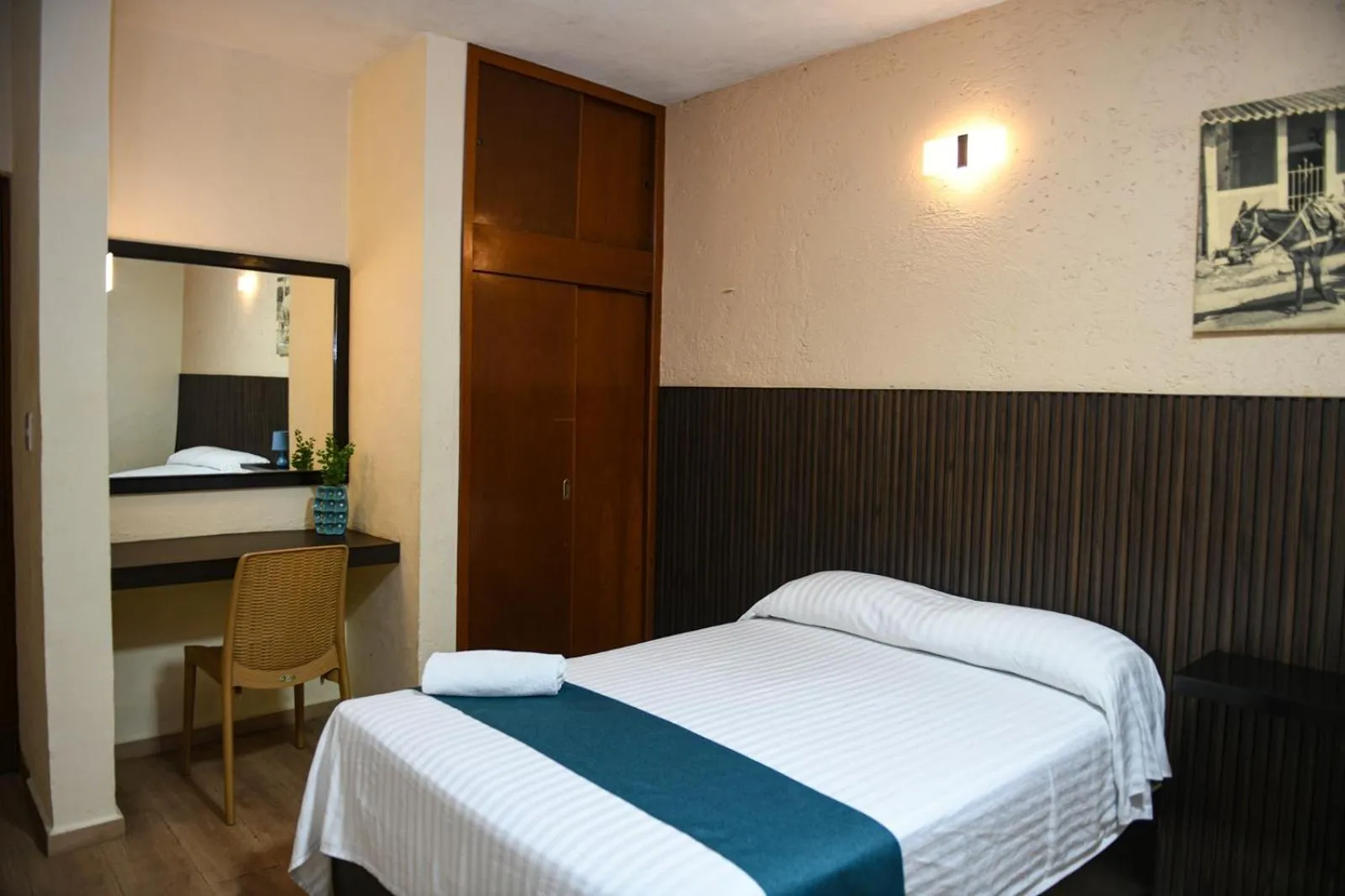 Bed in Hotel Uxulkah