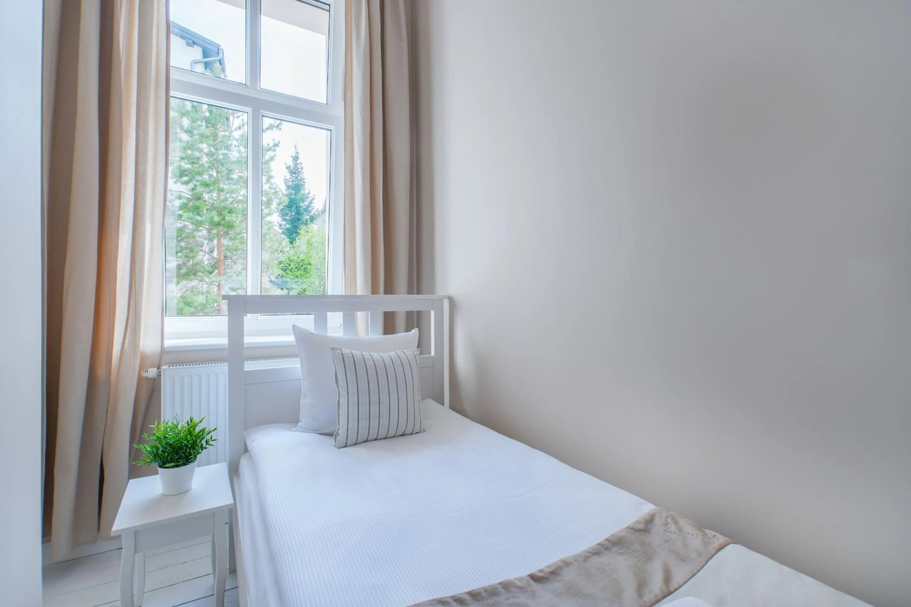 Bed in Riviera Residence Apartments