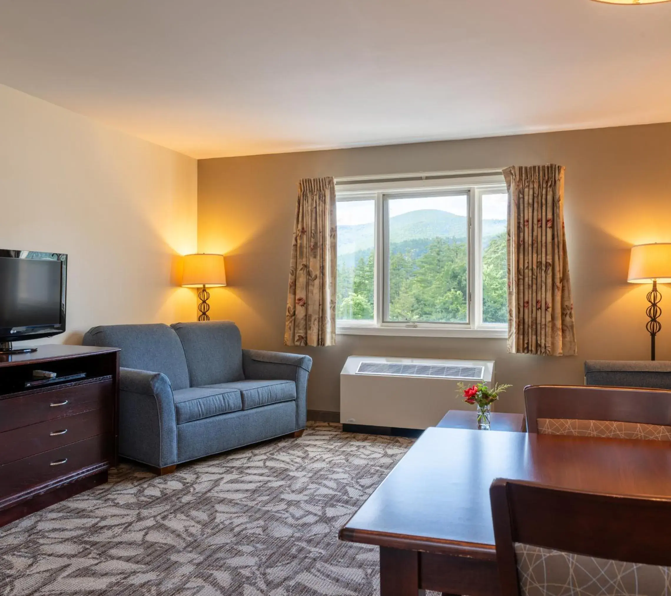 Living room, Bed in Grand Summit Hotel at Attitash Living room, Bed in Grand Summit Hotel at Attitash