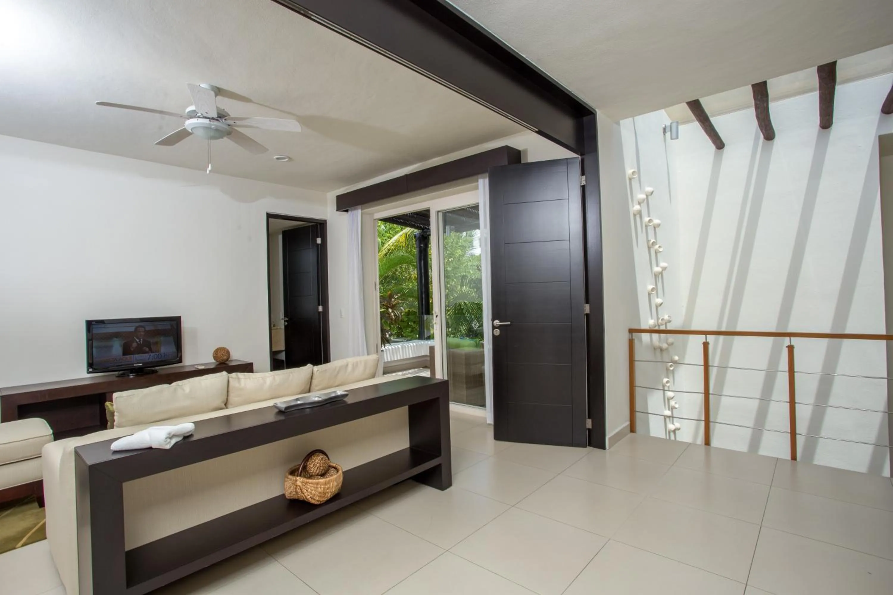 Communal lounge/ TV room, Bed in Marival Distinct All-Suites & World Spa - Handwritten Collection