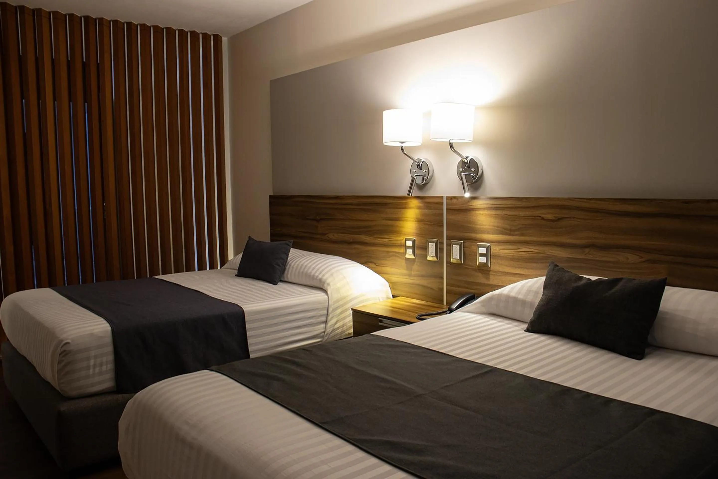 Bedroom, Bed in Estanza Hotel & Suites