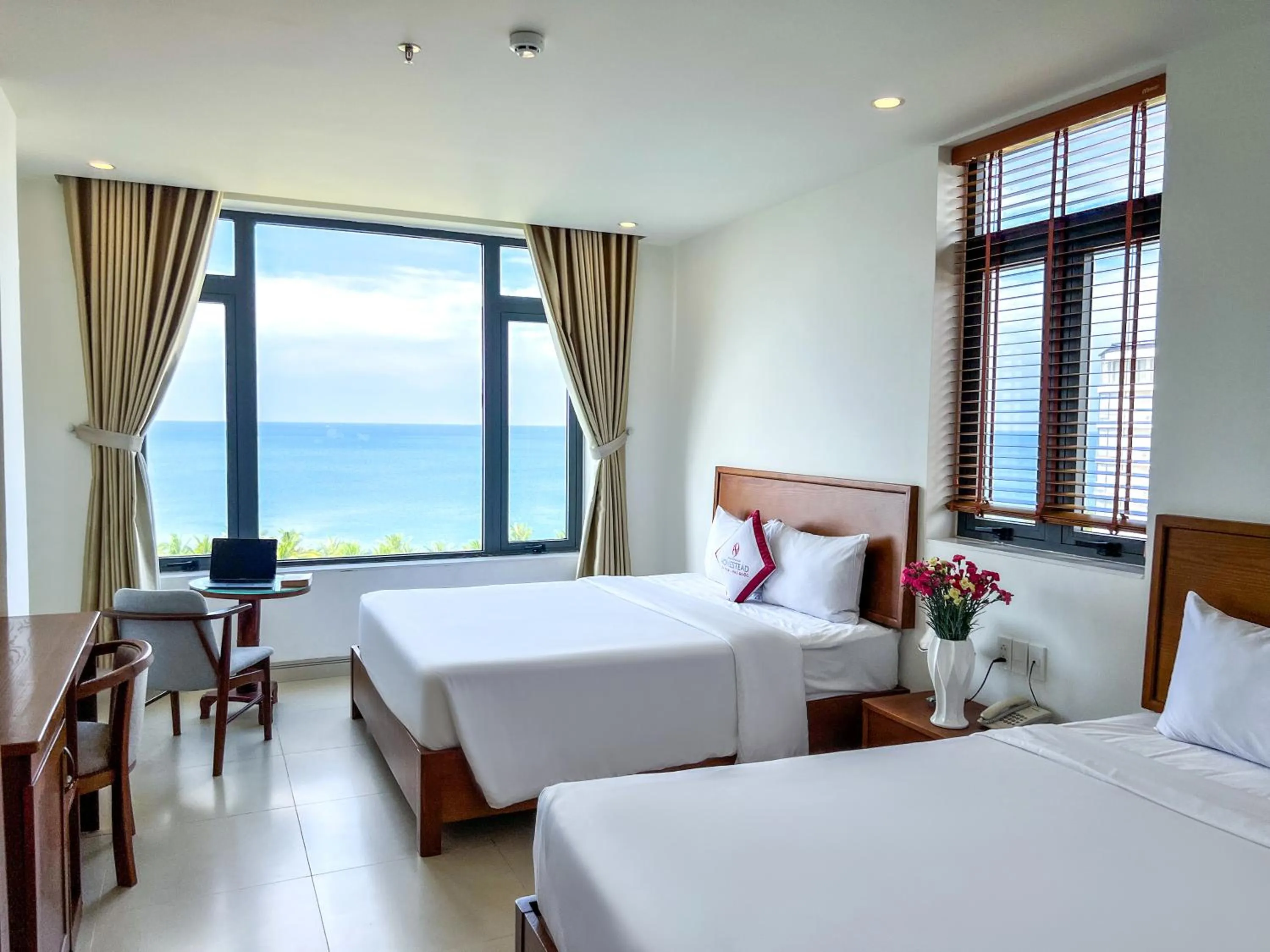 Bed in Homestead Seaview Phu Quoc Hotel