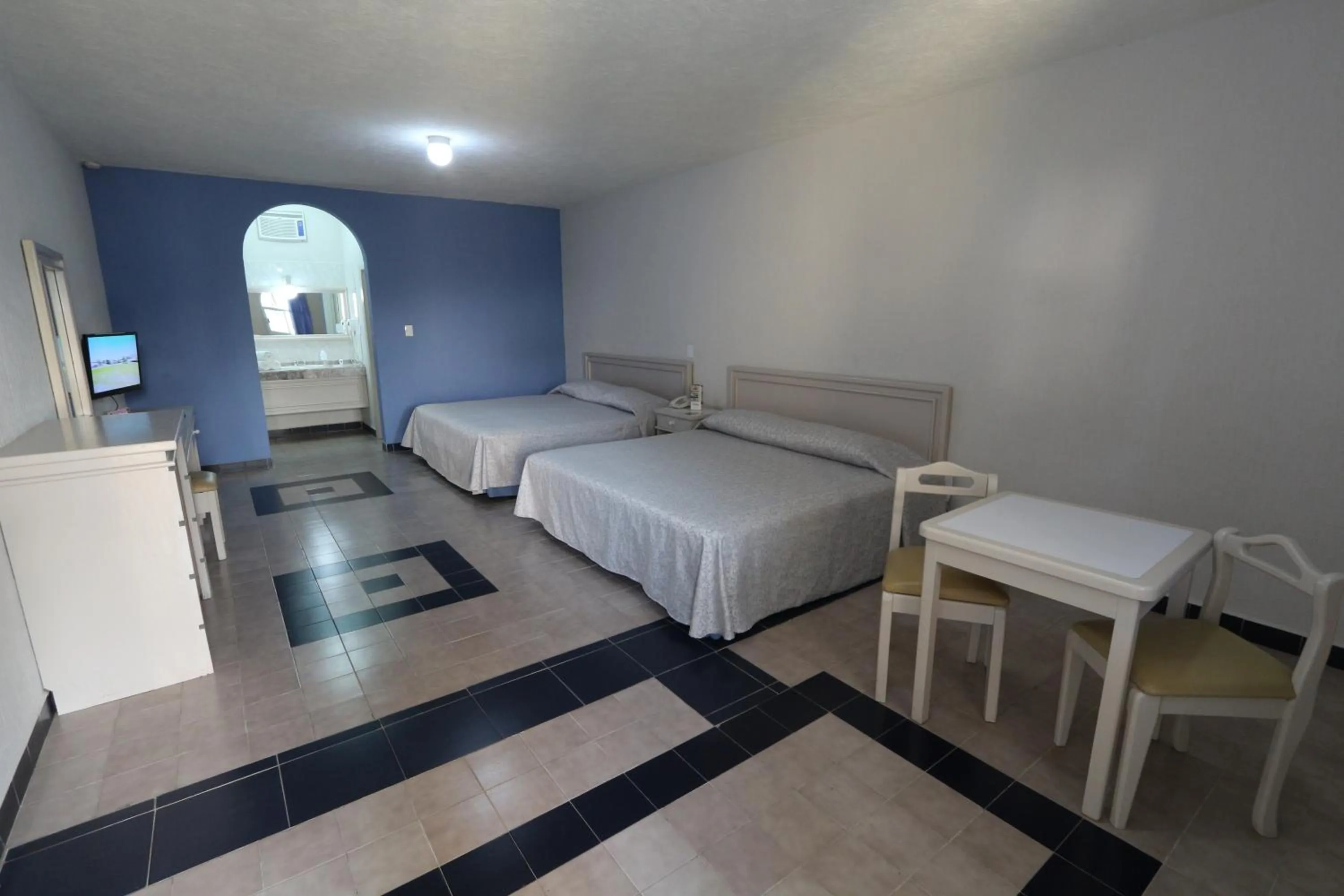 Bed in Dorados Conventions & Resort