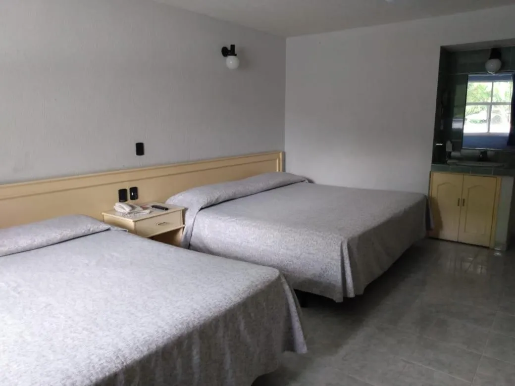 Bed in Dorados Conventions & Resort