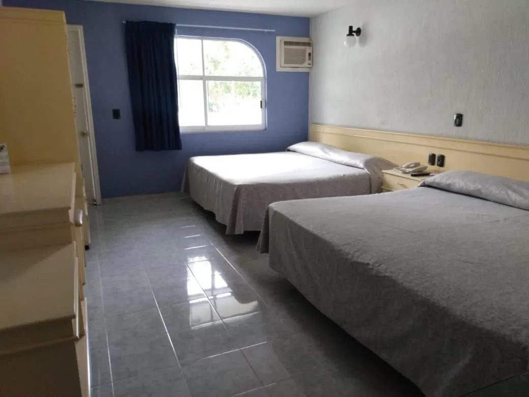 Bed in Dorados Conventions & Resort