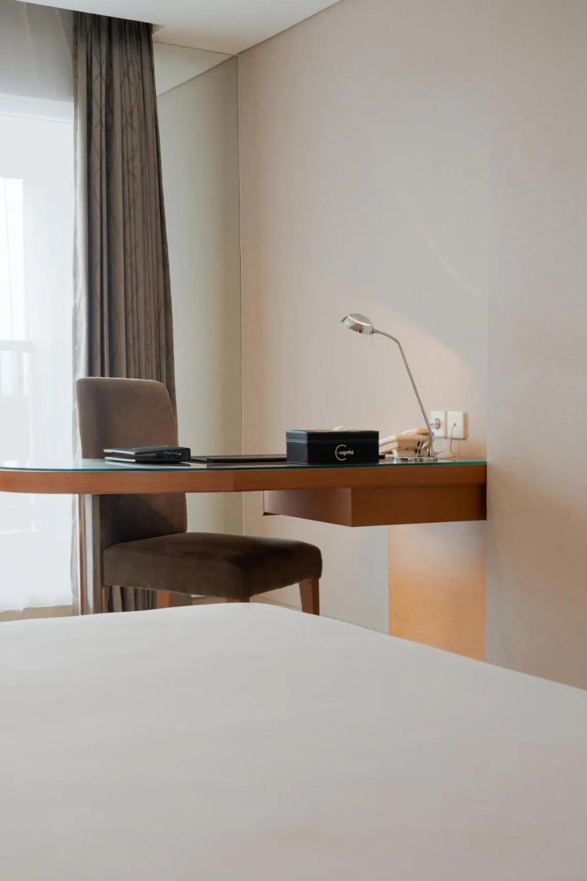 Photo of the whole room, Bed in The Capital Hotel Surabaya