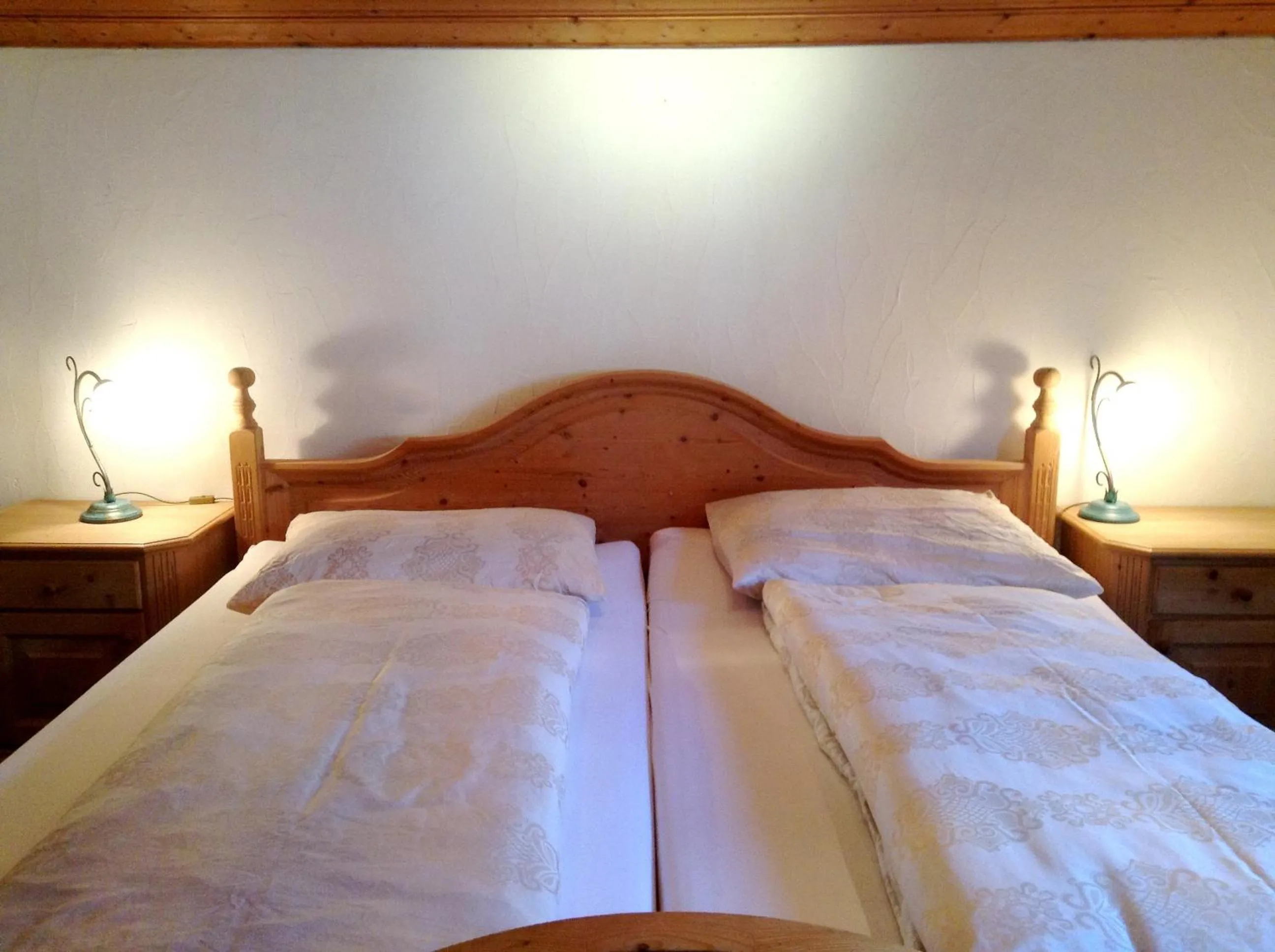 Bed in Chasa Sulai Appartements