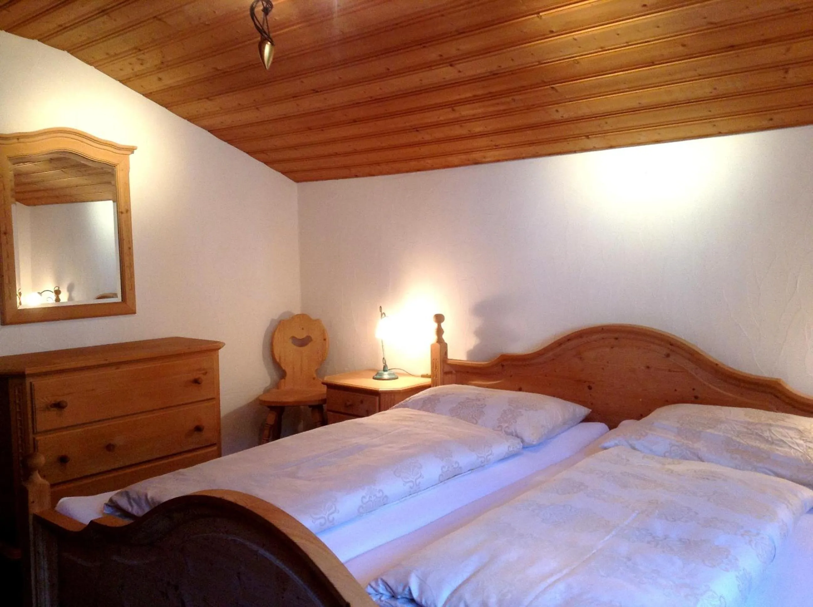 Bed in Chasa Sulai Appartements