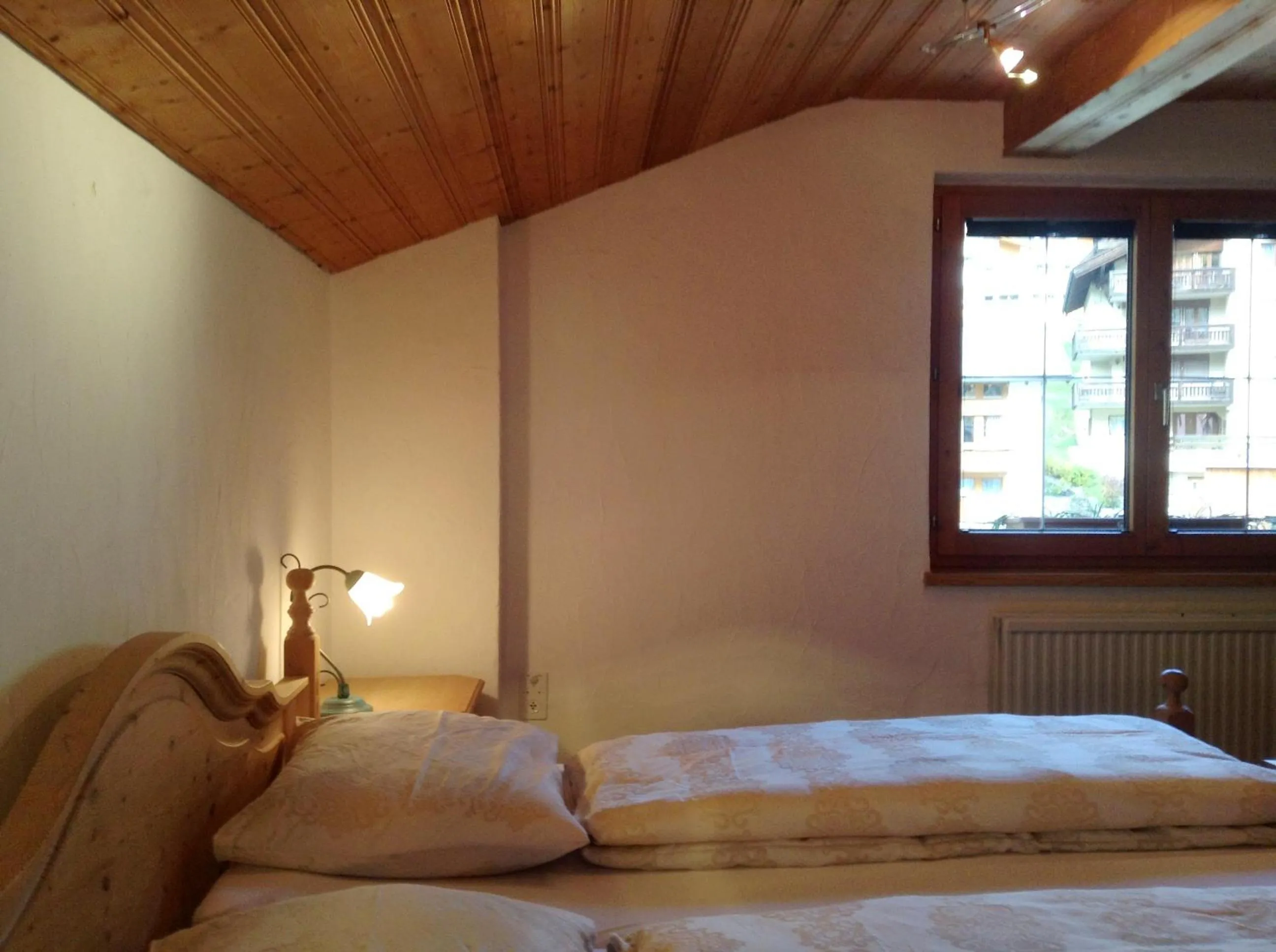 Bed in Chasa Sulai Appartements
