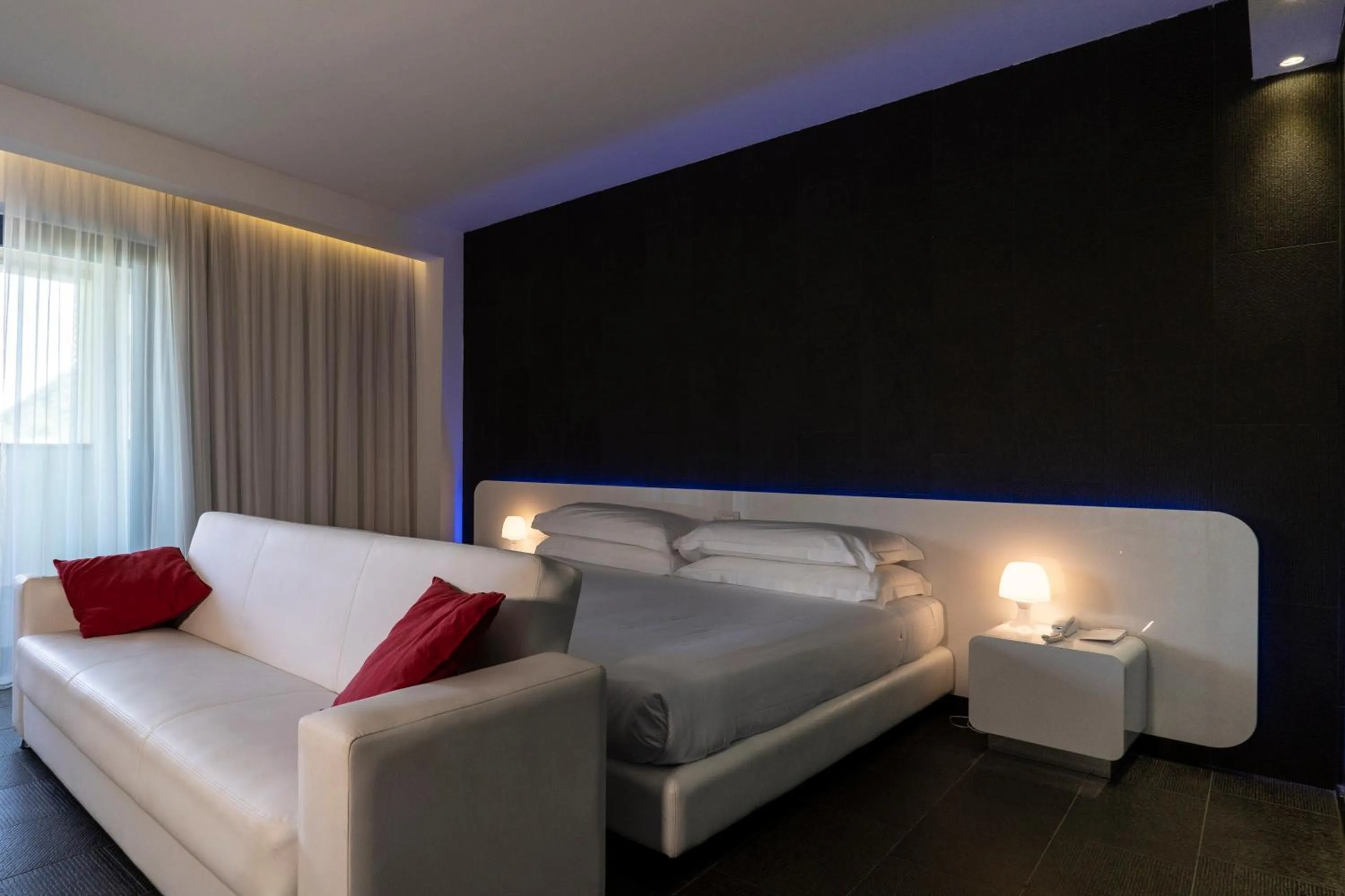 Living room, Bed in A Point Porto Ercole Resort & Spa