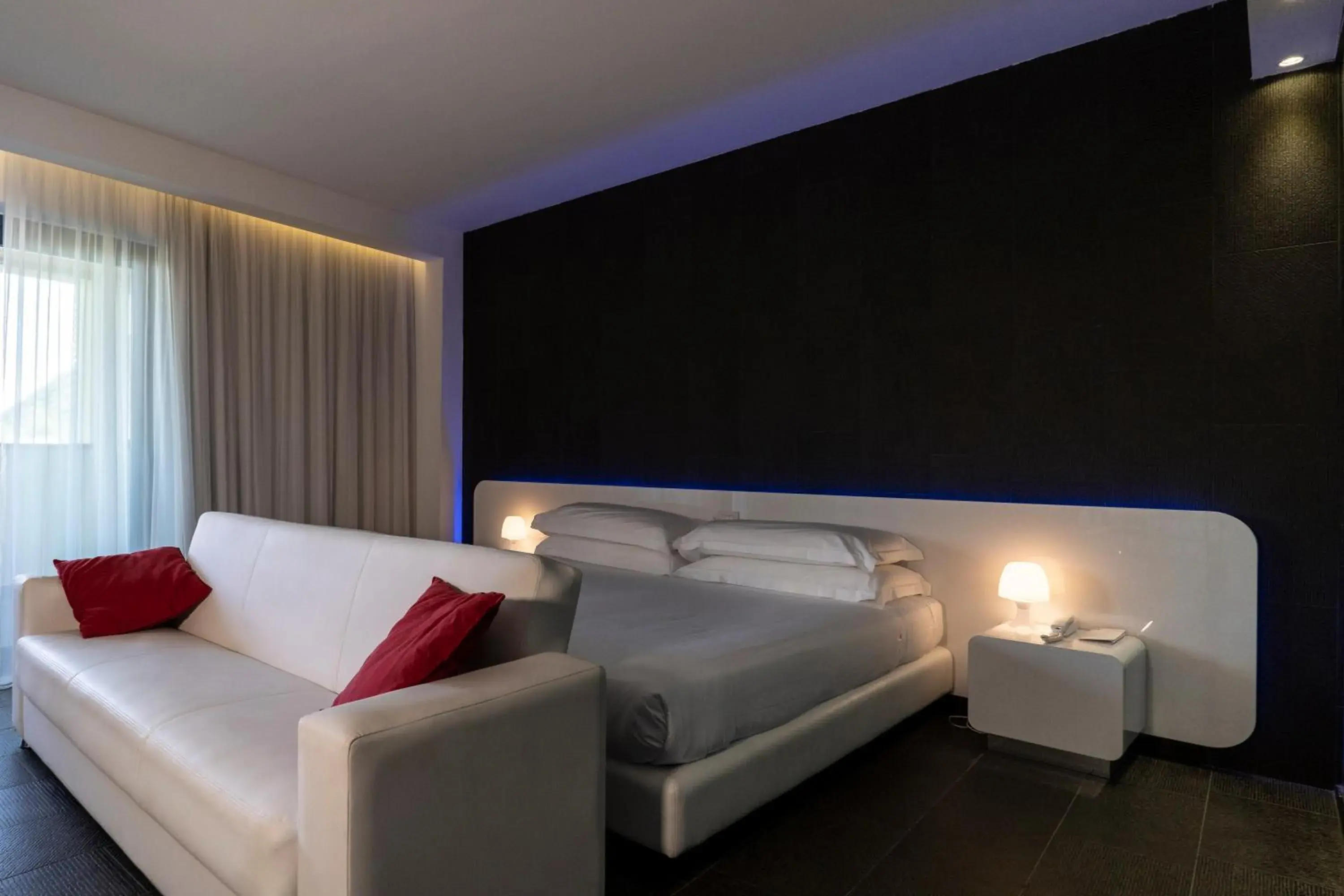 Living room, Bed in A Point Porto Ercole Resort & Spa Living room, Bed in A Point Porto Ercole Resort & Spa