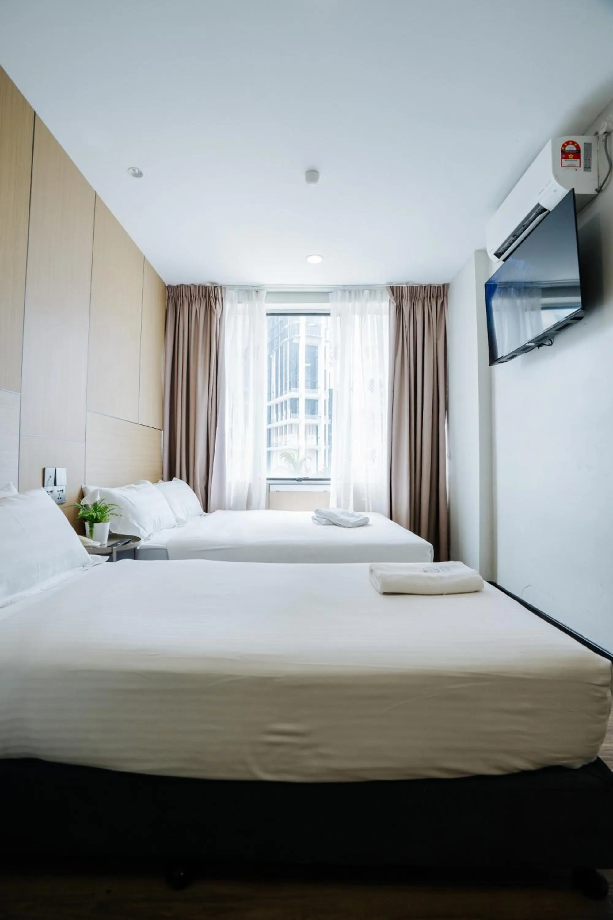 Bed in Wangs Hotel Gurney Drive