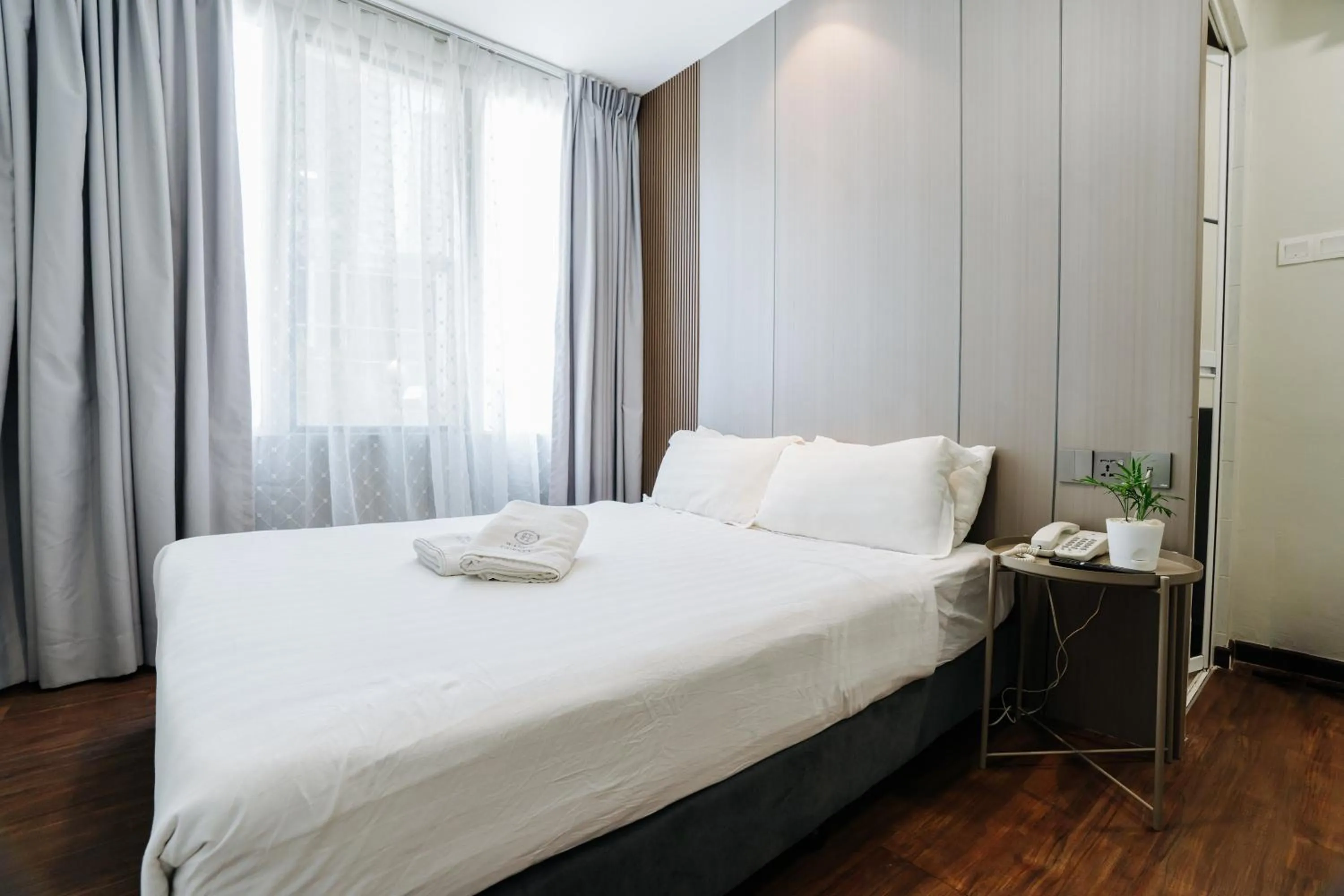 Bed in Wangs Hotel Gurney Drive