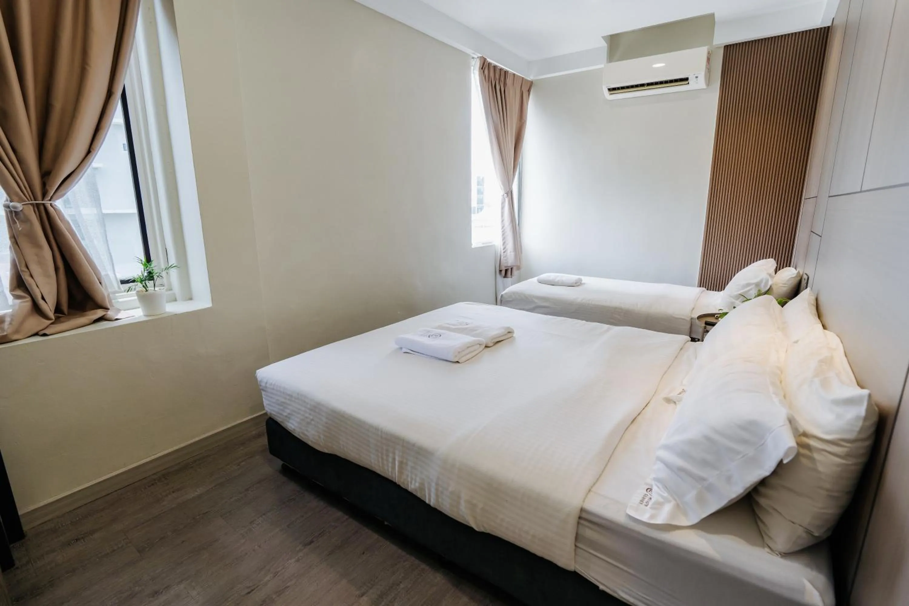 Bed in Wangs Hotel Gurney Drive