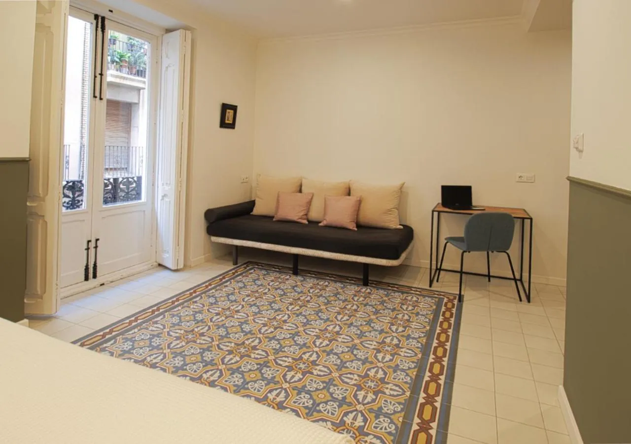 Living room, Bed in VALOLA Boutique Rooms