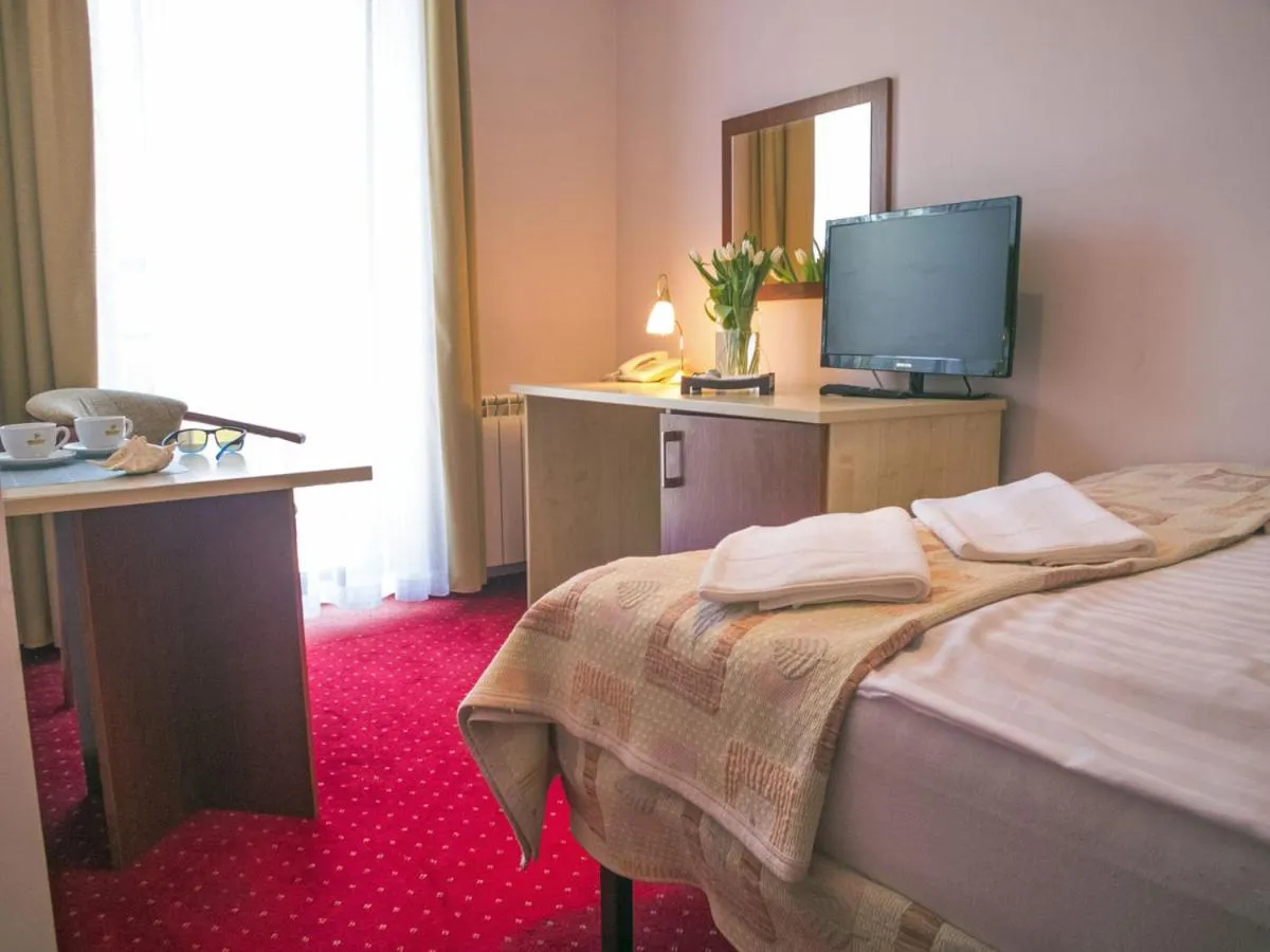 Bed in Hotel Aleksander