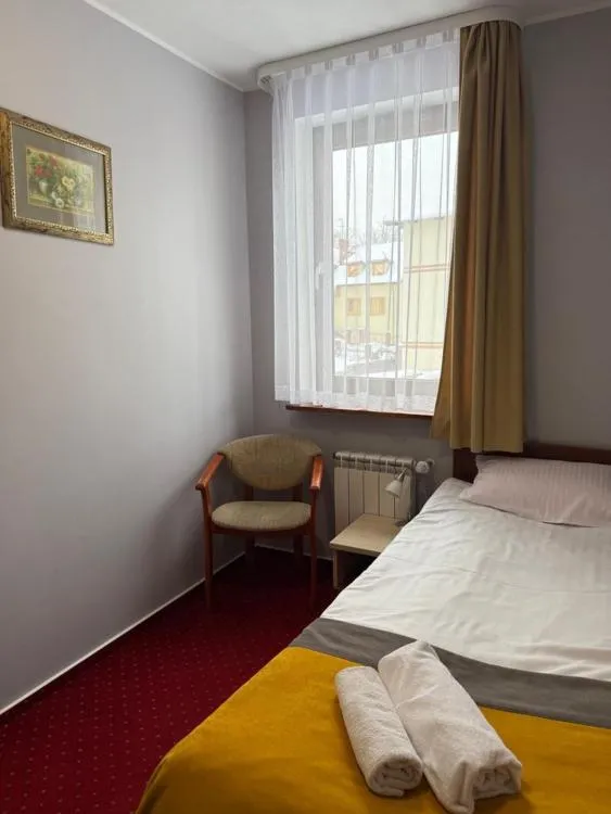 Bed in Hotel Aleksander