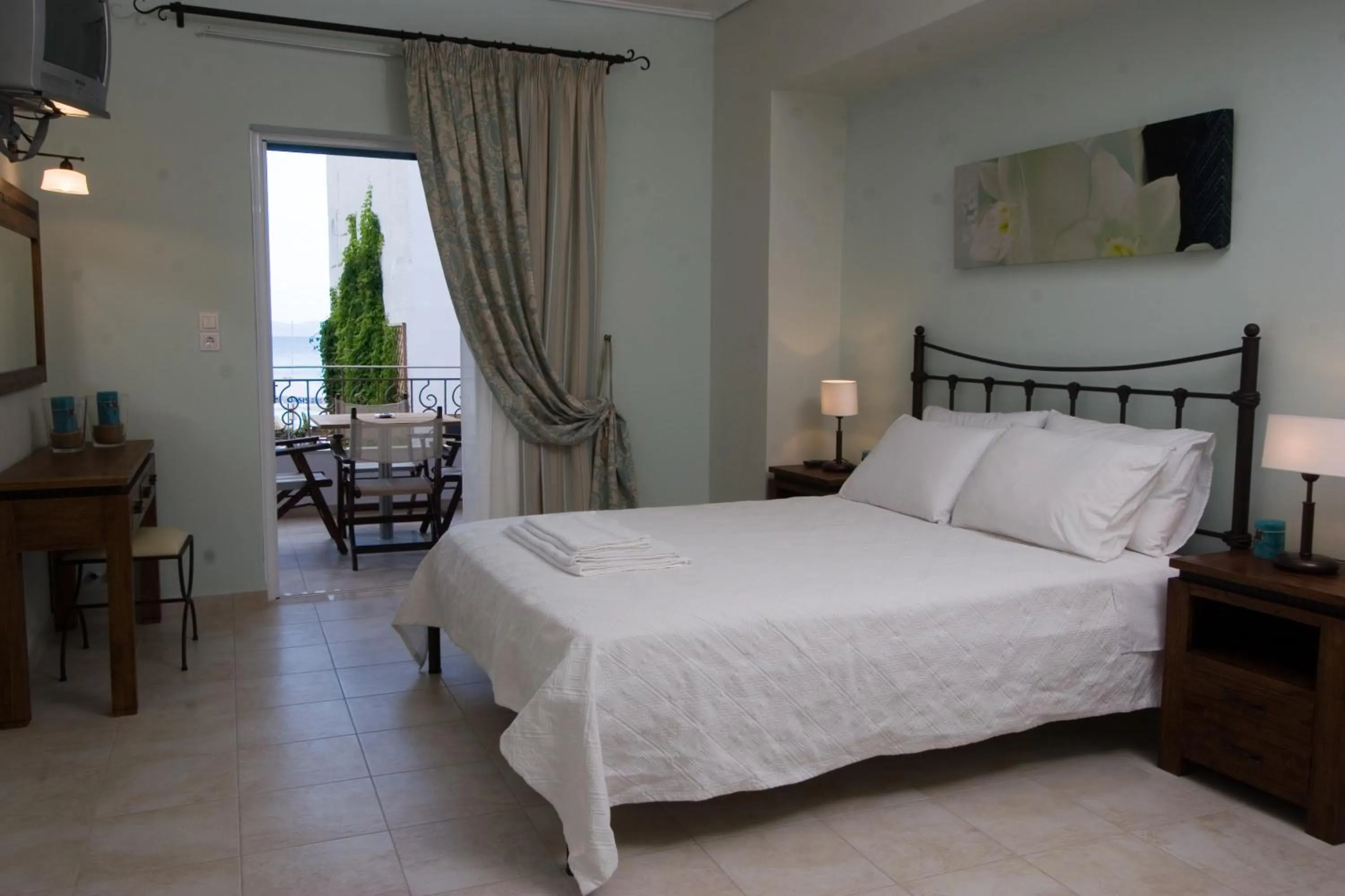 Bed in Oasis Beach Hotel