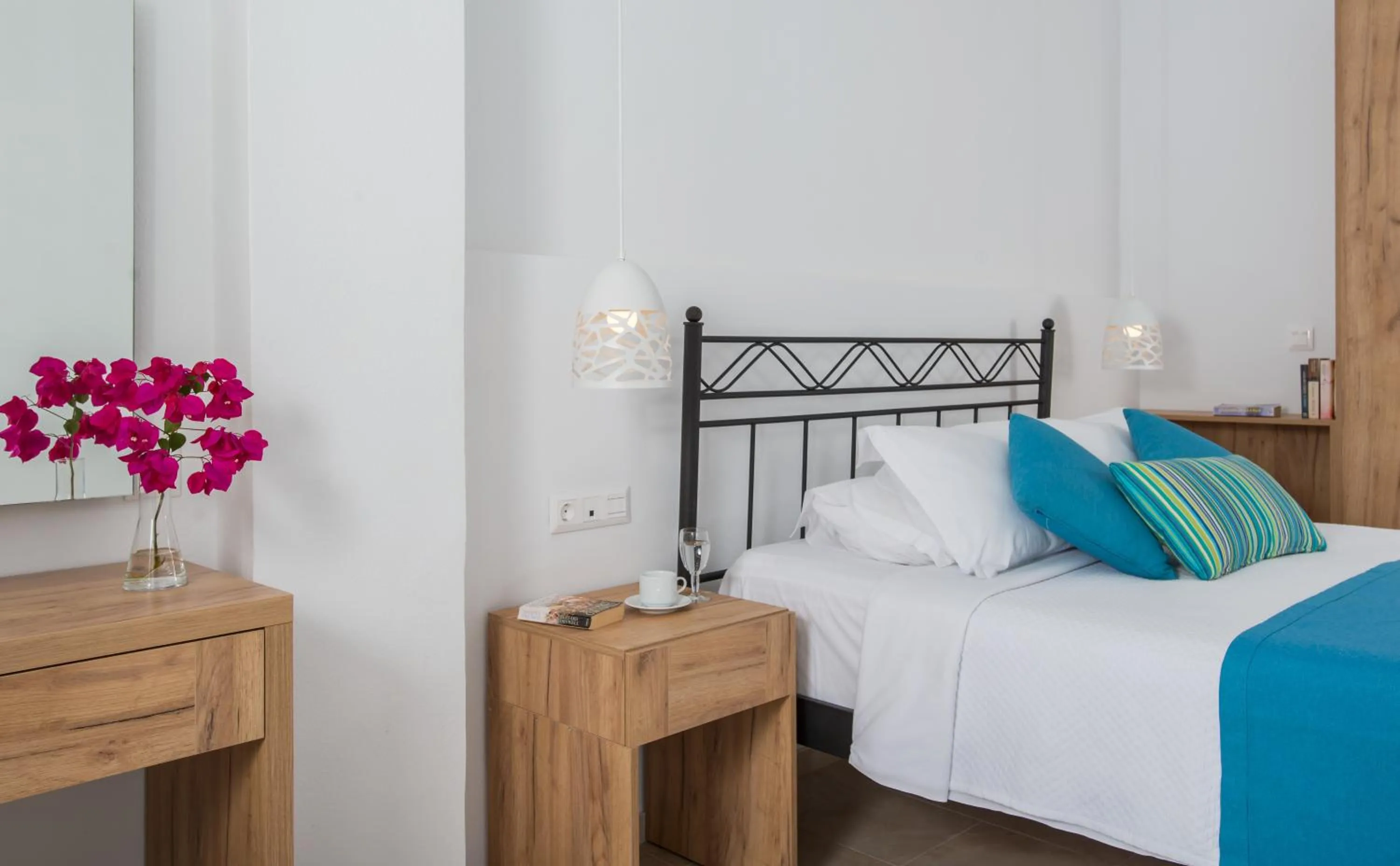 Bed in Oasis Beach Hotel