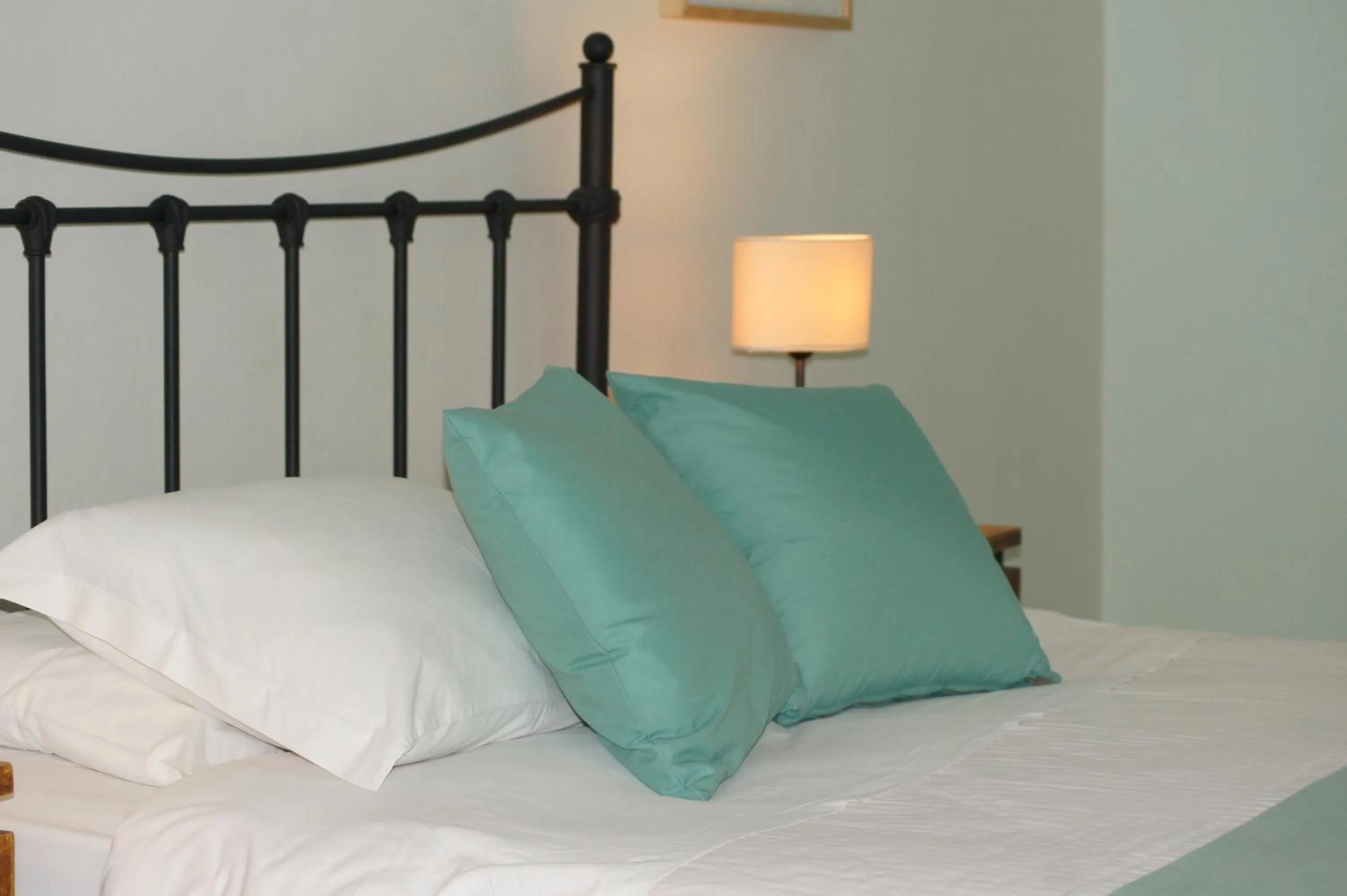 Bed in Oasis Beach Hotel