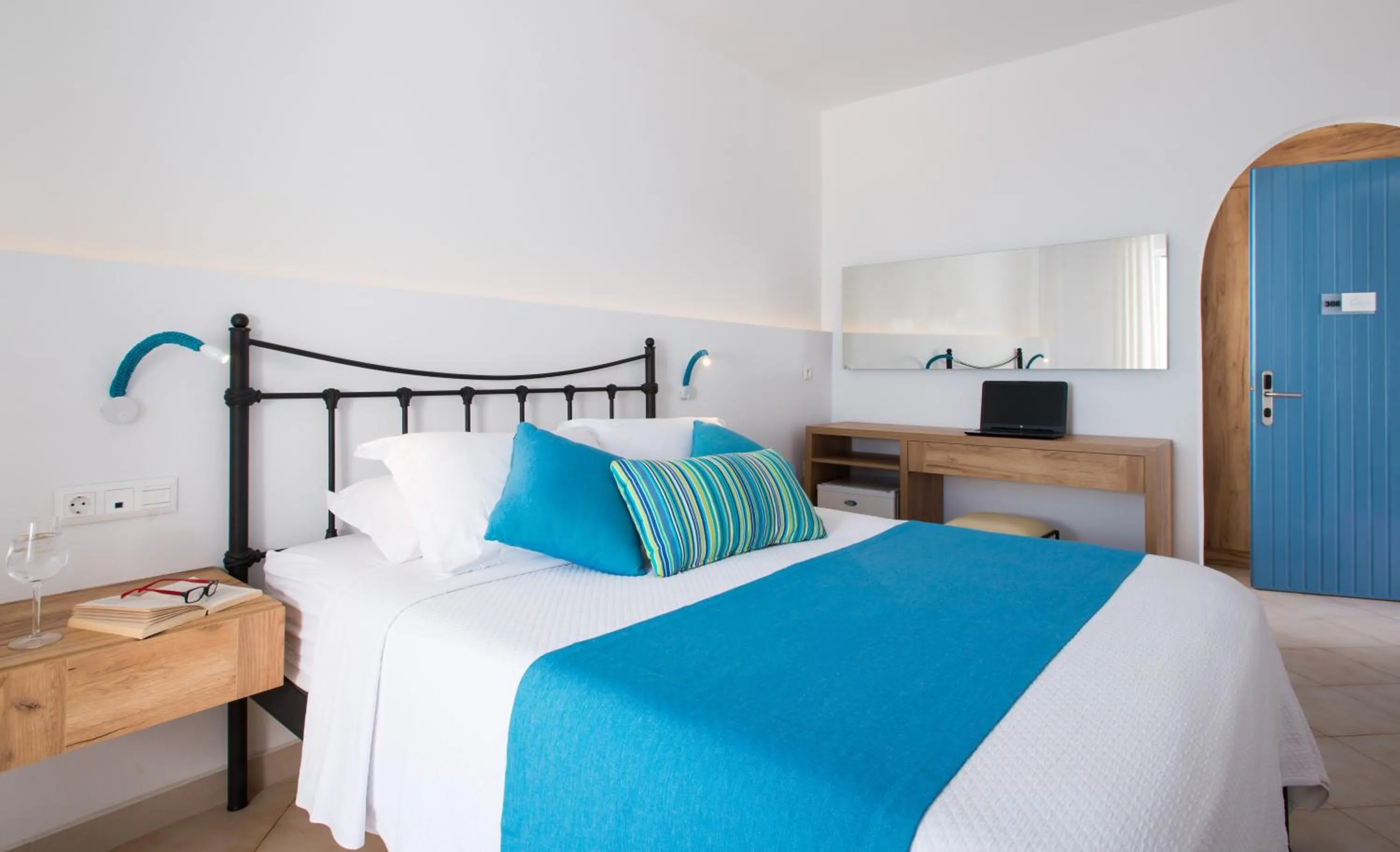 Bed in Oasis Beach Hotel