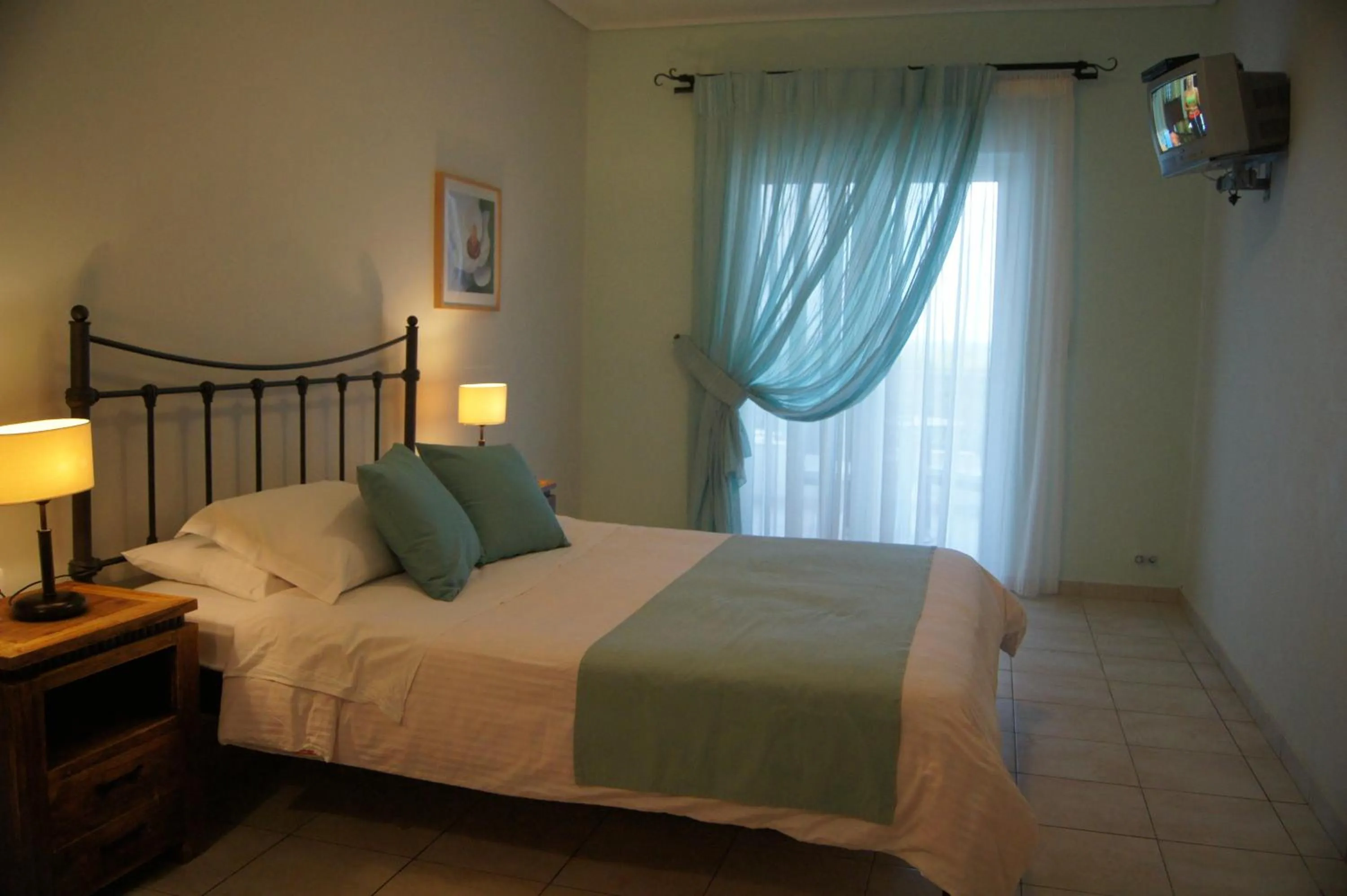 Bed in Oasis Beach Hotel