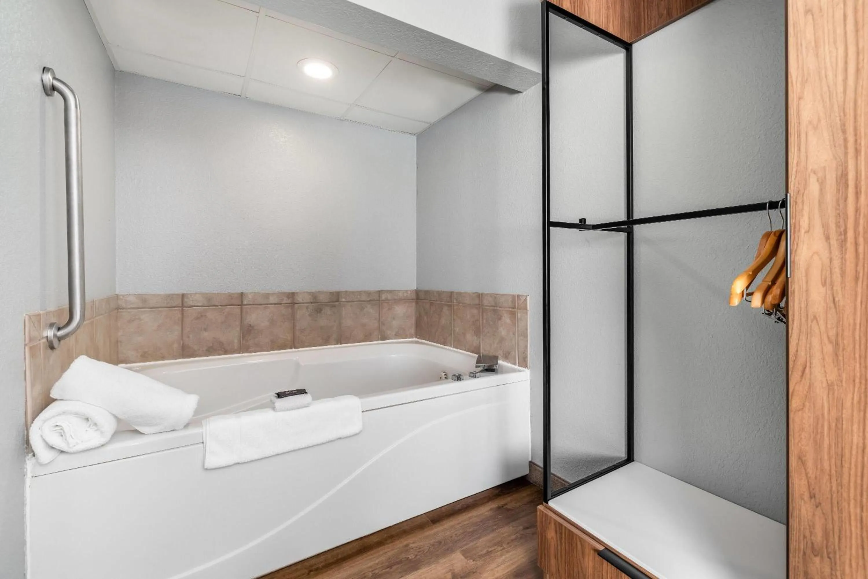 Bathroom, Bed in AmericInn by Wyndham Mounds View Minneapolis