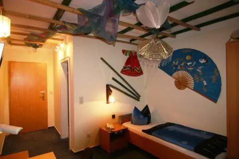 Photo of the whole room, Bed in Themen Hotel Terrassen Cafe