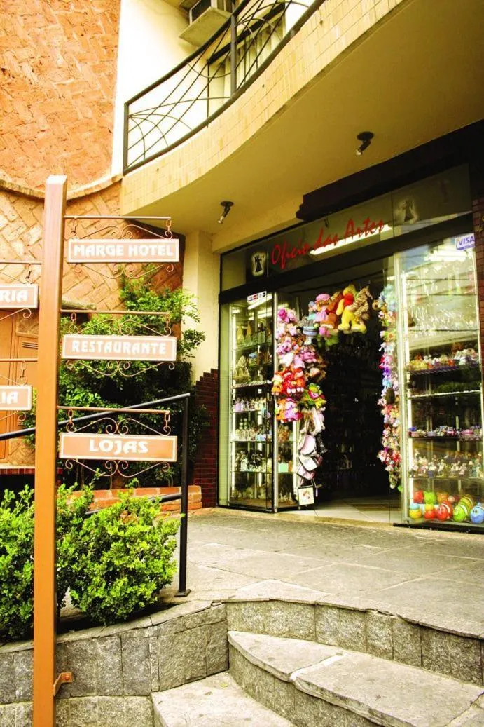 Property logo or sign in Marge Hotel