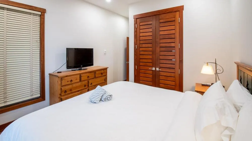 Bed in Snow Creek Lodge by Fernie Lodging Co