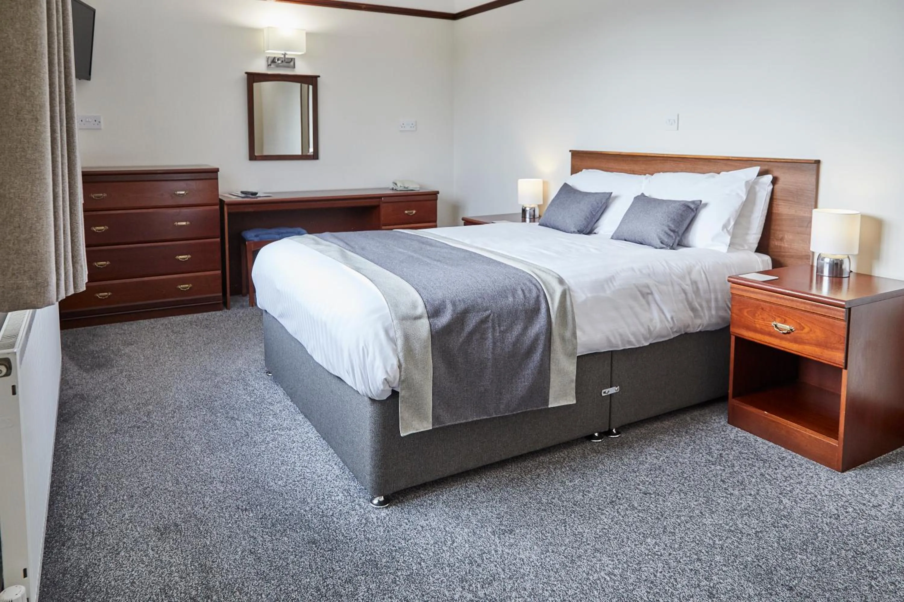 Bed in The Appleby Inn Hotel